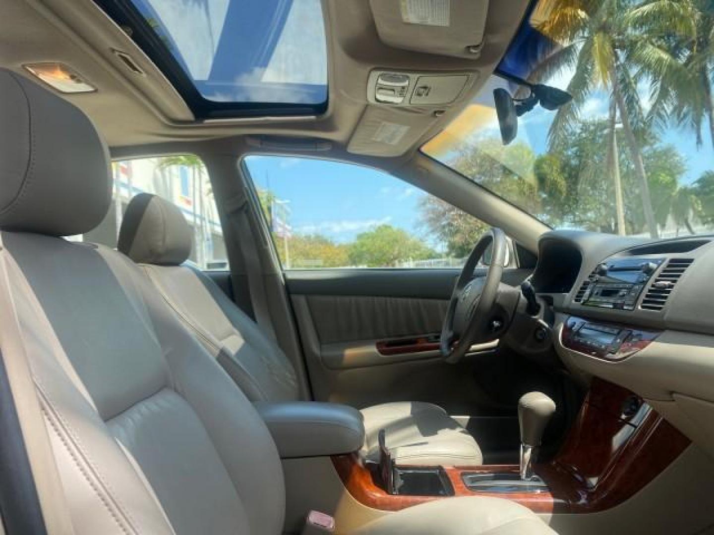 2005 Desert Sand Mica /Taupe Toyota Camry XLE V6 SUNROOF LEATHER (4T1BF30K35U) with an 3.0L DOHC MPFI Vvti 24-Valve V6 Engine engine, Automatic transmission, located at 4701 North Dixie Hwy, Pompano Beach, FL, 33064, (954) 422-2889, 26.240938, -80.123474 - OUR WEBPAGE FLORIDACARS1.COM HAS OVER 100 PHOTOS AND FREE CARFAX LINK 2005 TOYOTA CAMRY LE V6 SUNROOF LEATHER BUCKET SEATS VIN: 4T1BF30K35U597683 4 T 1 B F 3 0 K 3 5 U 5 9 7 6 8 3 SEDAN 4 DR 3.0L V6 F DOHC 24V GASOLINE 28 MPG FRONT WHEEL DRIVE TIRES ARE NEW ! Top Features Alloy Wheels Luxury Package - Photo#92