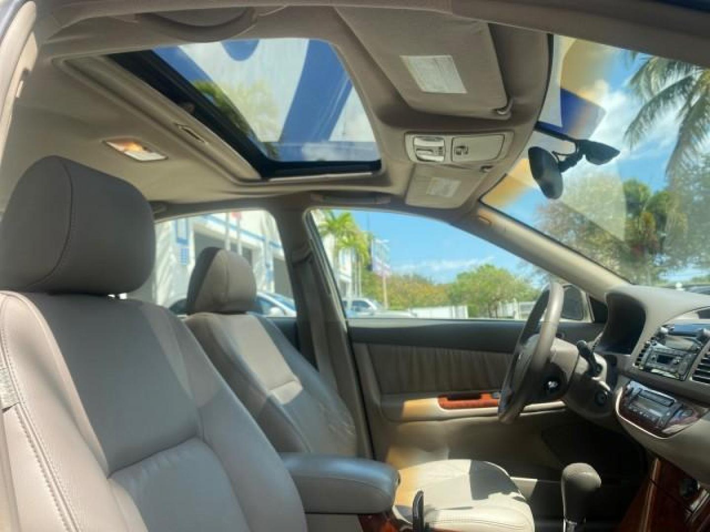 2005 Desert Sand Mica /Taupe Toyota Camry XLE V6 SUNROOF LEATHER (4T1BF30K35U) with an 3.0L DOHC MPFI Vvti 24-Valve V6 Engine engine, Automatic transmission, located at 4701 North Dixie Hwy, Pompano Beach, FL, 33064, (954) 422-2889, 26.240938, -80.123474 - OUR WEBPAGE FLORIDACARS1.COM HAS OVER 100 PHOTOS AND FREE CARFAX LINK 2005 TOYOTA CAMRY LE V6 SUNROOF LEATHER BUCKET SEATS VIN: 4T1BF30K35U597683 4 T 1 B F 3 0 K 3 5 U 5 9 7 6 8 3 SEDAN 4 DR 3.0L V6 F DOHC 24V GASOLINE 28 MPG FRONT WHEEL DRIVE TIRES ARE NEW ! Top Features Alloy Wheels Luxury Package - Photo#93