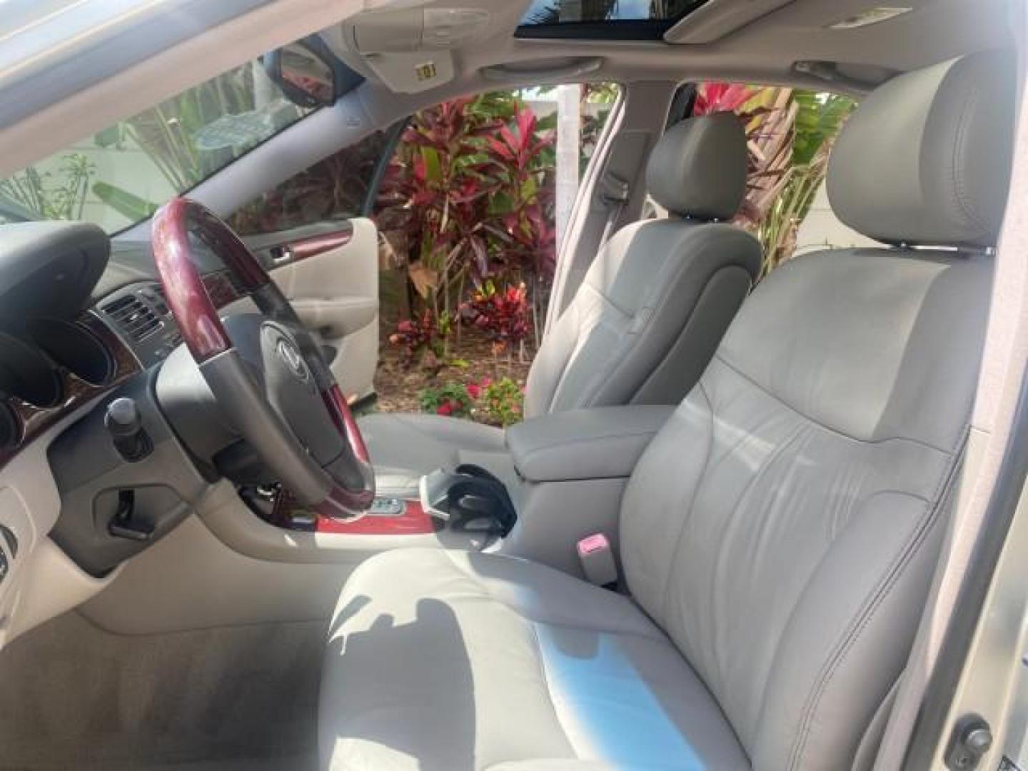2004 Alabaster Metallic /Light Charcoal Lexus ES 330 1 OWNER FL LOW MILES 51,802 (JTHBA30G240) with an 3.3L DOHC EFI 24-Valve V6 Engine engine, Automatic transmission, located at 4701 North Dixie Hwy, Pompano Beach, FL, 33064, (954) 422-2889, 26.240938, -80.123474 - OUR WEBPAGE FLORIDACARS1.COM HAS OVER 100 PHOTOS AND FREE CARFAX LINK 2004 LEXUS ES 330 VIN: JTHBA30G240002762 J T H B A 3 0 G 2 4 0 0 0 2 7 6 2 SEDAN 4 DR 3.3L V6 F 24V GASOLINE 29 MPG FRONT WHEEL DRIVE Top Features Alloy Wheels Leather Seats Memory Seat(s) Sunroof(s) Basic Features ABS Brakes CD A - Photo#10