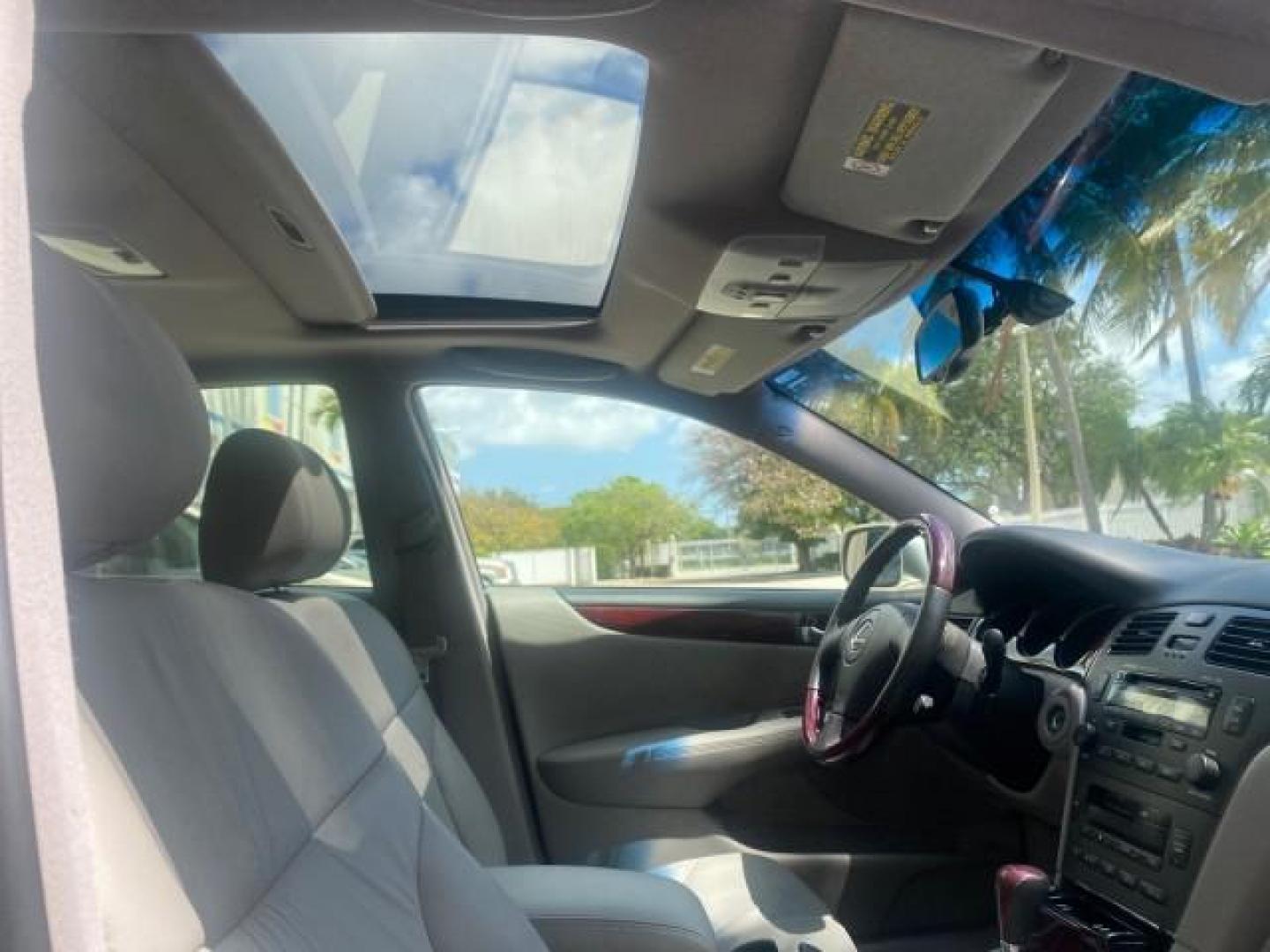 2004 Alabaster Metallic /Light Charcoal Lexus ES 330 1 OWNER FL LOW MILES 51,802 (JTHBA30G240) with an 3.3L DOHC EFI 24-Valve V6 Engine engine, Automatic transmission, located at 4701 North Dixie Hwy, Pompano Beach, FL, 33064, (954) 422-2889, 26.240938, -80.123474 - OUR WEBPAGE FLORIDACARS1.COM HAS OVER 100 PHOTOS AND FREE CARFAX LINK 2004 LEXUS ES 330 VIN: JTHBA30G240002762 J T H B A 3 0 G 2 4 0 0 0 2 7 6 2 SEDAN 4 DR 3.3L V6 F 24V GASOLINE 29 MPG FRONT WHEEL DRIVE Top Features Alloy Wheels Leather Seats Memory Seat(s) Sunroof(s) Basic Features ABS Brakes CD A - Photo#93