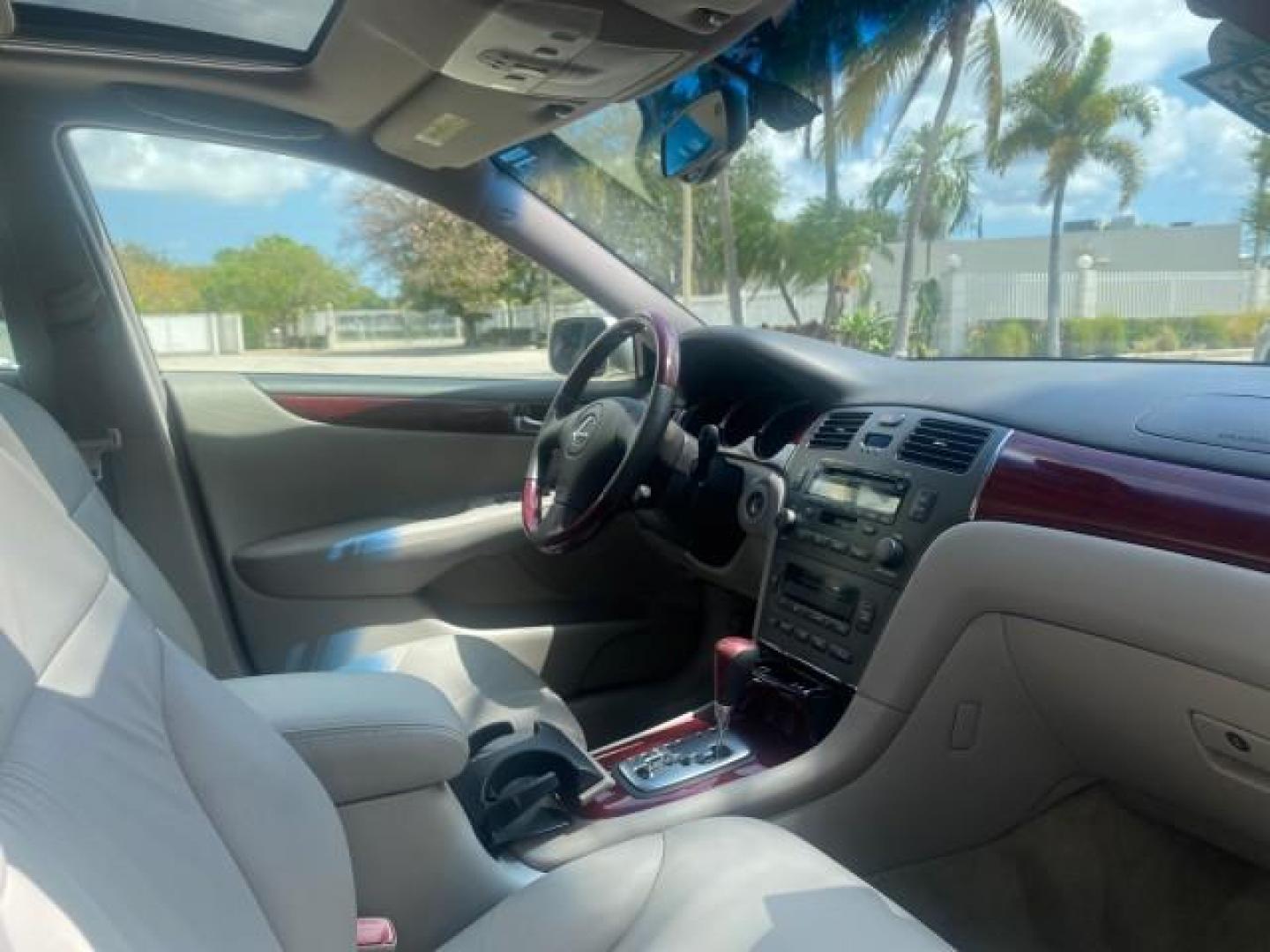 2004 Alabaster Metallic /Light Charcoal Lexus ES 330 1 OWNER FL LOW MILES 51,802 (JTHBA30G240) with an 3.3L DOHC EFI 24-Valve V6 Engine engine, Automatic transmission, located at 4701 North Dixie Hwy, Pompano Beach, FL, 33064, (954) 422-2889, 26.240938, -80.123474 - OUR WEBPAGE FLORIDACARS1.COM HAS OVER 100 PHOTOS AND FREE CARFAX LINK 2004 LEXUS ES 330 VIN: JTHBA30G240002762 J T H B A 3 0 G 2 4 0 0 0 2 7 6 2 SEDAN 4 DR 3.3L V6 F 24V GASOLINE 29 MPG FRONT WHEEL DRIVE Top Features Alloy Wheels Leather Seats Memory Seat(s) Sunroof(s) Basic Features ABS Brakes CD A - Photo#94