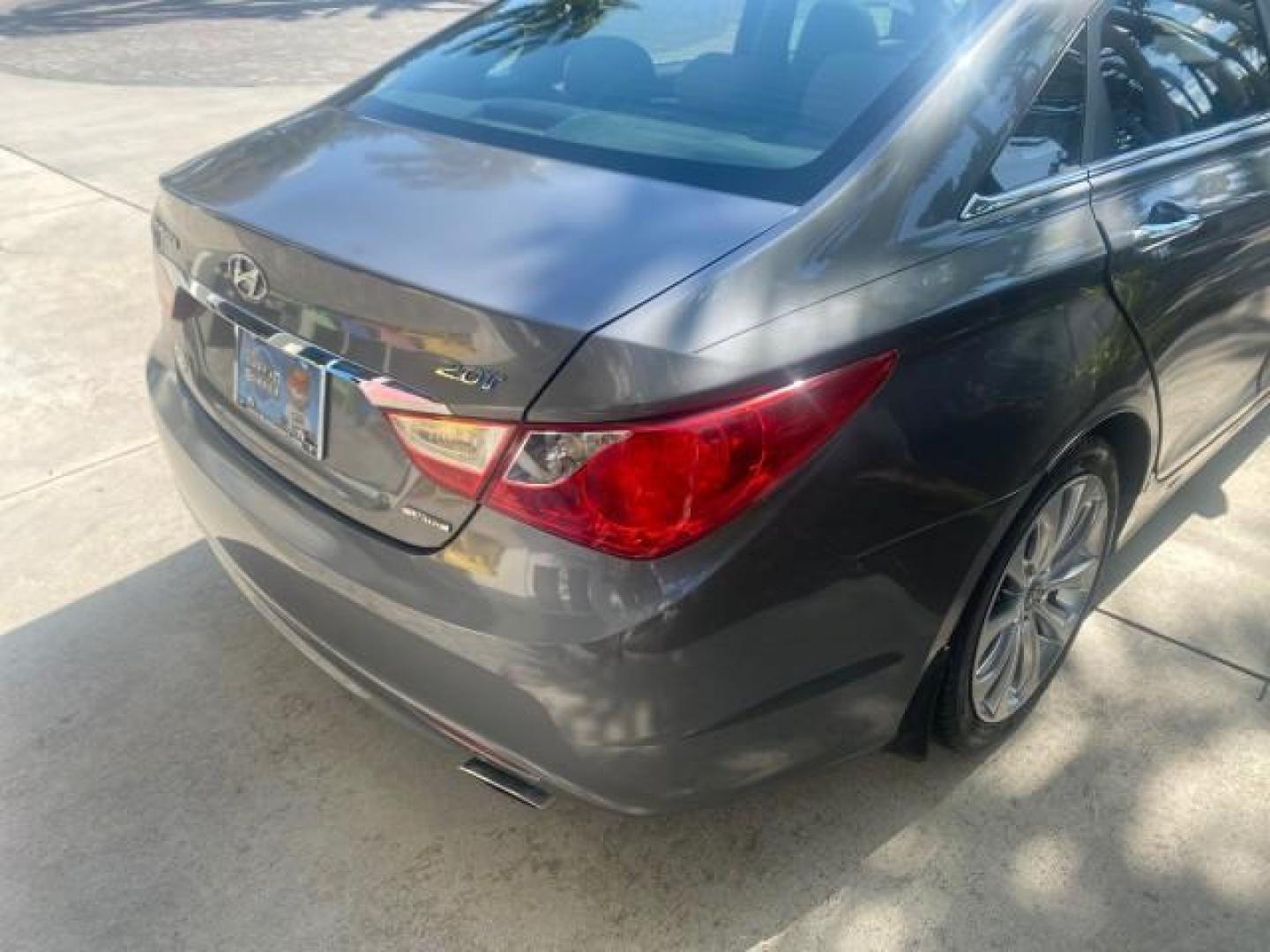 2013 Harbor Gray Metallic /Gray Hyundai Sonata Limited 29 SERVICES FL (5NPEC4AB5DH) with an 2.0L DOHC 16-Valve I4 Turbocharged GDI Engine engine, Automatic transmission, located at 4701 North Dixie Hwy, Pompano Beach, FL, 33064, (954) 422-2889, 26.240938, -80.123474 - OUR WEBPAGE FLORIDACARS1.COM HAS OVER 100 PHOTOS AND FREE CARFAX LINK 2013 HYUNDAI SONATA SE 2.0T VIN: 5NPEC4AB5DH558214 5 N P E C 4 A B 5 D H 5 5 8 2 1 4 SEDAN 4 DR 2.0L I4 F DOHC 16V GASOLINE FRONT WHEEL DRIVE Highlighted Features Sunroof CD Player Leather Seats Alloy Wheels Power Windows Power Lo - Photo#75
