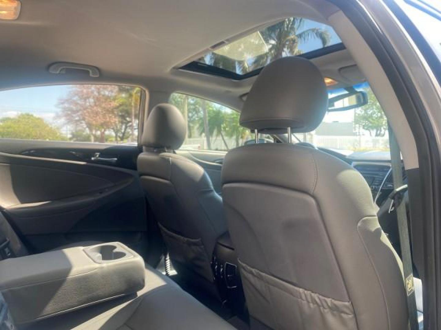 2013 Harbor Gray Metallic /Gray Hyundai Sonata Limited 29 SERVICES FL (5NPEC4AB5DH) with an 2.0L DOHC 16-Valve I4 Turbocharged GDI Engine engine, Automatic transmission, located at 4701 North Dixie Hwy, Pompano Beach, FL, 33064, (954) 422-2889, 26.240938, -80.123474 - OUR WEBPAGE FLORIDACARS1.COM HAS OVER 100 PHOTOS AND FREE CARFAX LINK 2013 HYUNDAI SONATA SE 2.0T VIN: 5NPEC4AB5DH558214 5 N P E C 4 A B 5 D H 5 5 8 2 1 4 SEDAN 4 DR 2.0L I4 F DOHC 16V GASOLINE FRONT WHEEL DRIVE Highlighted Features Sunroof CD Player Leather Seats Alloy Wheels Power Windows Power Lo - Photo#86