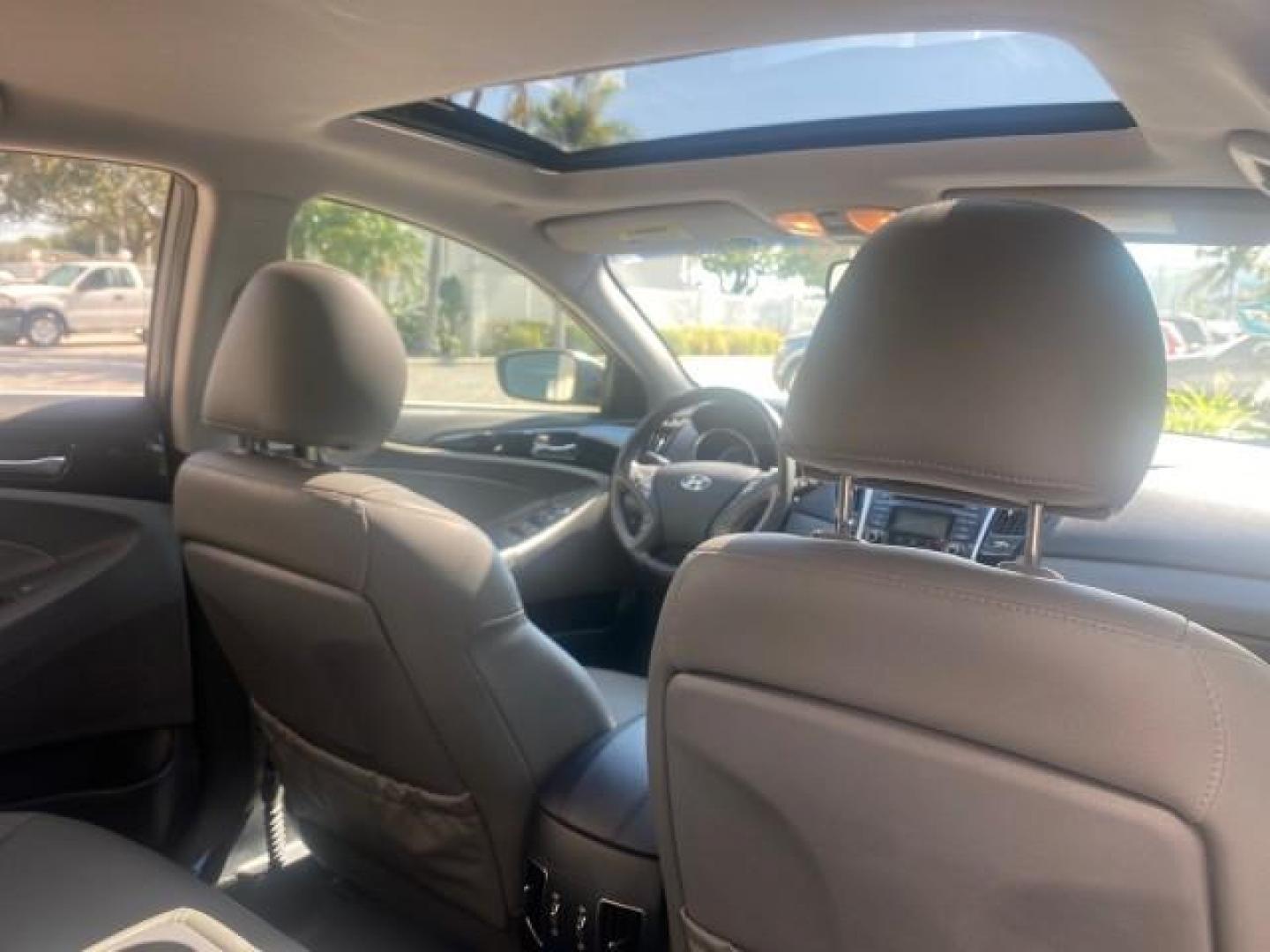 2013 Harbor Gray Metallic /Gray Hyundai Sonata Limited 29 SERVICES FL (5NPEC4AB5DH) with an 2.0L DOHC 16-Valve I4 Turbocharged GDI Engine engine, Automatic transmission, located at 4701 North Dixie Hwy, Pompano Beach, FL, 33064, (954) 422-2889, 26.240938, -80.123474 - OUR WEBPAGE FLORIDACARS1.COM HAS OVER 100 PHOTOS AND FREE CARFAX LINK 2013 HYUNDAI SONATA SE 2.0T VIN: 5NPEC4AB5DH558214 5 N P E C 4 A B 5 D H 5 5 8 2 1 4 SEDAN 4 DR 2.0L I4 F DOHC 16V GASOLINE FRONT WHEEL DRIVE Highlighted Features Sunroof CD Player Leather Seats Alloy Wheels Power Windows Power Lo - Photo#88