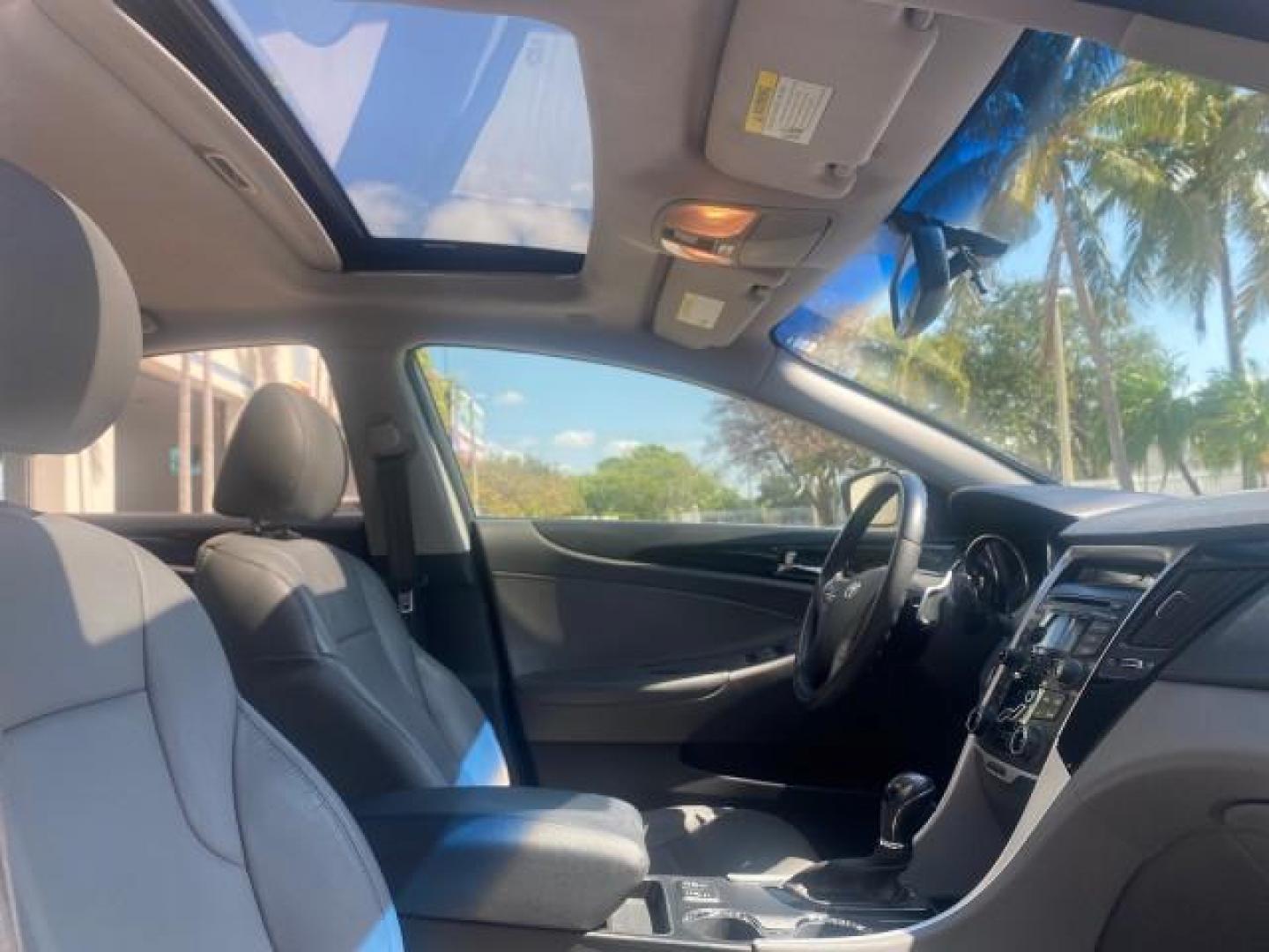 2013 Harbor Gray Metallic /Gray Hyundai Sonata Limited 29 SERVICES FL (5NPEC4AB5DH) with an 2.0L DOHC 16-Valve I4 Turbocharged GDI Engine engine, Automatic transmission, located at 4701 North Dixie Hwy, Pompano Beach, FL, 33064, (954) 422-2889, 26.240938, -80.123474 - OUR WEBPAGE FLORIDACARS1.COM HAS OVER 100 PHOTOS AND FREE CARFAX LINK 2013 HYUNDAI SONATA SE 2.0T VIN: 5NPEC4AB5DH558214 5 N P E C 4 A B 5 D H 5 5 8 2 1 4 SEDAN 4 DR 2.0L I4 F DOHC 16V GASOLINE FRONT WHEEL DRIVE Highlighted Features Sunroof CD Player Leather Seats Alloy Wheels Power Windows Power Lo - Photo#93