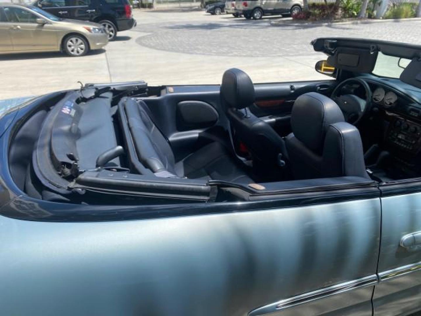 2002 Steel Blue Pearl /Deep Royal Blue Chrysler Sebring Limited 1 OWNER FL LOW MILES 37,932 (1C3EL65RX2N) with an 2.7L MFI DOHC 24-Valve V6 Engine engine, Automatic transmission, located at 4701 North Dixie Hwy, Pompano Beach, FL, 33064, (954) 422-2889, 26.240938, -80.123474 - OUR WEBPAGE FLORIDACARS1.COM HAS OVER 100 PHOTOS AND FREE CARFAX LINK 2002 CHRYSLER SEBRING LIMITED VIN: 1C3EL65RX2N127842 1 C 3 E L 6 5 R X 2 N 1 2 7 8 4 2 CONVERTIBLE 2.7L V6 F DOHC GASOLINE FRONT WHEEL DRIVE Top Features Alloy Wheels Soft Top Infinity Sound System Sunroof(s) Leather Seats Basic F - Photo#78