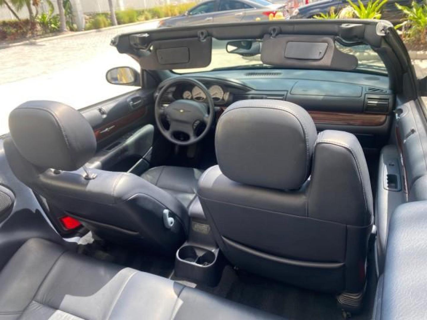 2002 Steel Blue Pearl /Deep Royal Blue Chrysler Sebring Limited 1 OWNER FL LOW MILES 37,932 (1C3EL65RX2N) with an 2.7L MFI DOHC 24-Valve V6 Engine engine, Automatic transmission, located at 4701 North Dixie Hwy, Pompano Beach, FL, 33064, (954) 422-2889, 26.240938, -80.123474 - OUR WEBPAGE FLORIDACARS1.COM HAS OVER 100 PHOTOS AND FREE CARFAX LINK 2002 CHRYSLER SEBRING LIMITED VIN: 1C3EL65RX2N127842 1 C 3 E L 6 5 R X 2 N 1 2 7 8 4 2 CONVERTIBLE 2.7L V6 F DOHC GASOLINE FRONT WHEEL DRIVE Top Features Alloy Wheels Soft Top Infinity Sound System Sunroof(s) Leather Seats Basic F - Photo#81