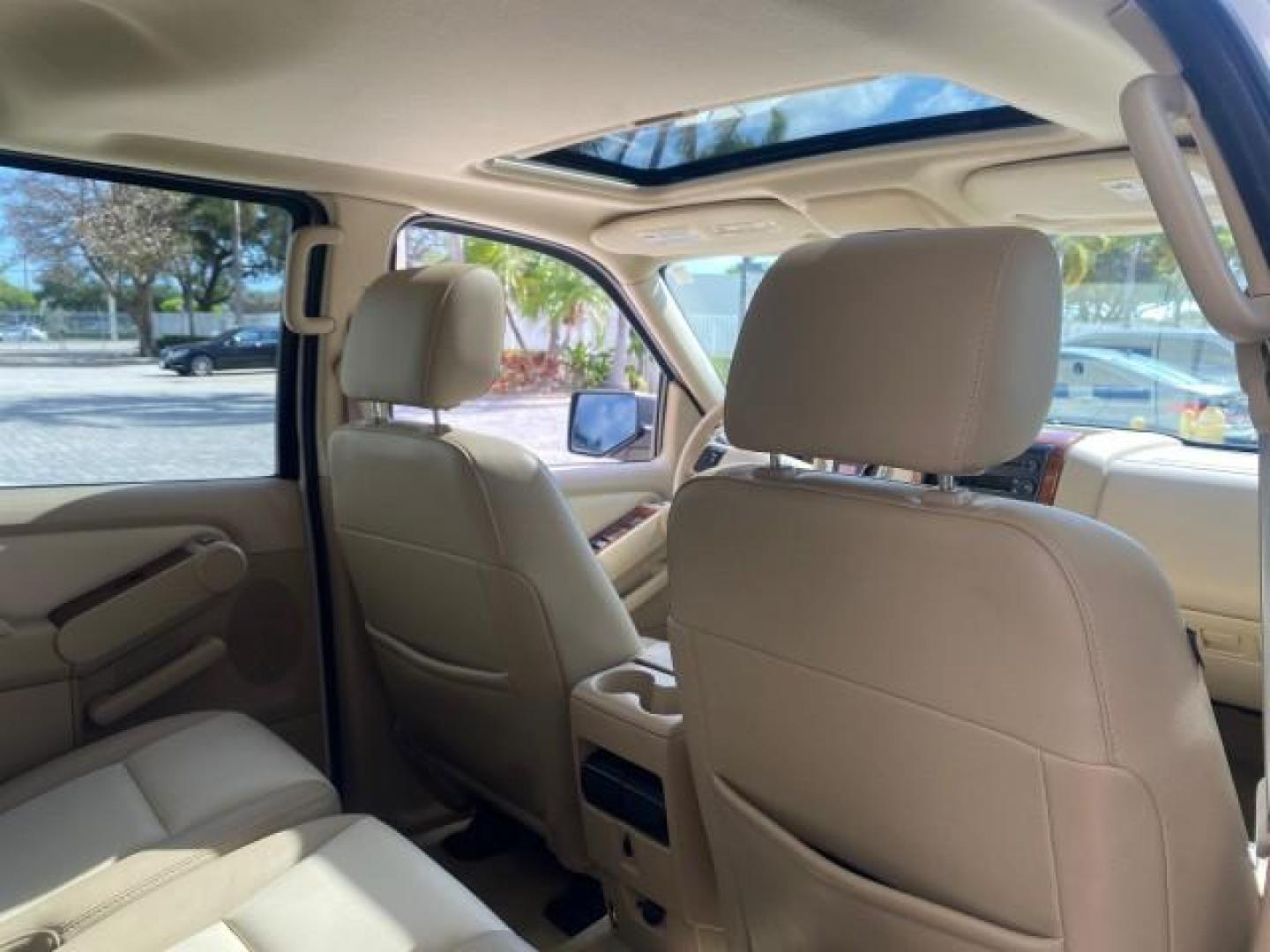 2006 Oxford White /Camel Ford Explorer Eddie Bauer 1 OWNER LOW MILES 88,841 (1FMEU64E56U) with an 4.0L SOHC V6 Engine engine, Automatic transmission, located at 4701 North Dixie Hwy, Pompano Beach, FL, 33064, (954) 422-2889, 26.240938, -80.123474 - OUR WEBPAGE FLORIDACARS1.COM HAS OVER 100 PHOTOS AND FREE CARFAX LINK 2006 FORD EXPLORER EDDIE BAUER VIN: 1FMEU64E56UA54894 1 F M E U 6 4 E 5 6 U A 5 4 8 9 4 4 DOOR WAGON/SPORT UTILITY 4.0L V6 F SOHC GASOLINE REAR WHEEL DRIVE Top Features Alloy Wheels Running Boards Leather Seats Sunroof(s) Parking - Photo#91