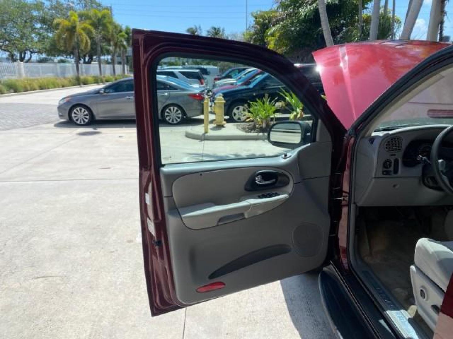 2005 Majestic Red Metallic /Light Gray Chevrolet TrailBlazer LS 39 SERVICES 1 OWNER (1GNDS13SX52) with an 4.2L Vortec 4200 SFI I6 Engine engine, Automatic transmission, located at 4701 North Dixie Hwy, Pompano Beach, FL, 33064, (954) 422-2889, 26.240938, -80.123474 - OUR WEBPAGE FLORIDACARS1.COM HAS OVER 100 PHOTOS AND FREE CARFAX LINK 2005 CHEVROLET TRAILBLAZER LS VIN: 1GNDS13SX52293455 1 G N D S 1 3 S X 5 2 2 9 3 4 5 5 4 DOOR WAGON/SPORT UTILITY 4.2L I6 F GASOLINE REAR WHEEL DRIVE TIRES LOOK NEW! Top Features Alloy Wheels Running Boards Cloth Seats Tow Hitch C - Photo#9
