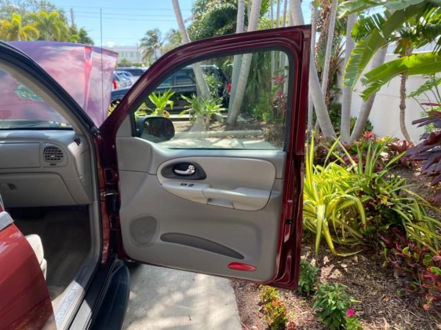 2005 Majestic Red Metallic /Light Gray Chevrolet TrailBlazer LS 39 SERVICES 1 OWNER (1GNDS13SX52) with an 4.2L Vortec 4200 SFI I6 Engine engine, Automatic transmission, located at 4701 North Dixie Hwy, Pompano Beach, FL, 33064, (954) 422-2889, 26.240938, -80.123474 - OUR WEBPAGE FLORIDACARS1.COM HAS OVER 100 PHOTOS AND FREE CARFAX LINK 2005 CHEVROLET TRAILBLAZER LS VIN: 1GNDS13SX52293455 1 G N D S 1 3 S X 5 2 2 9 3 4 5 5 4 DOOR WAGON/SPORT UTILITY 4.2L I6 F GASOLINE REAR WHEEL DRIVE TIRES LOOK NEW! Top Features Alloy Wheels Running Boards Cloth Seats Tow Hitch C - Photo#11