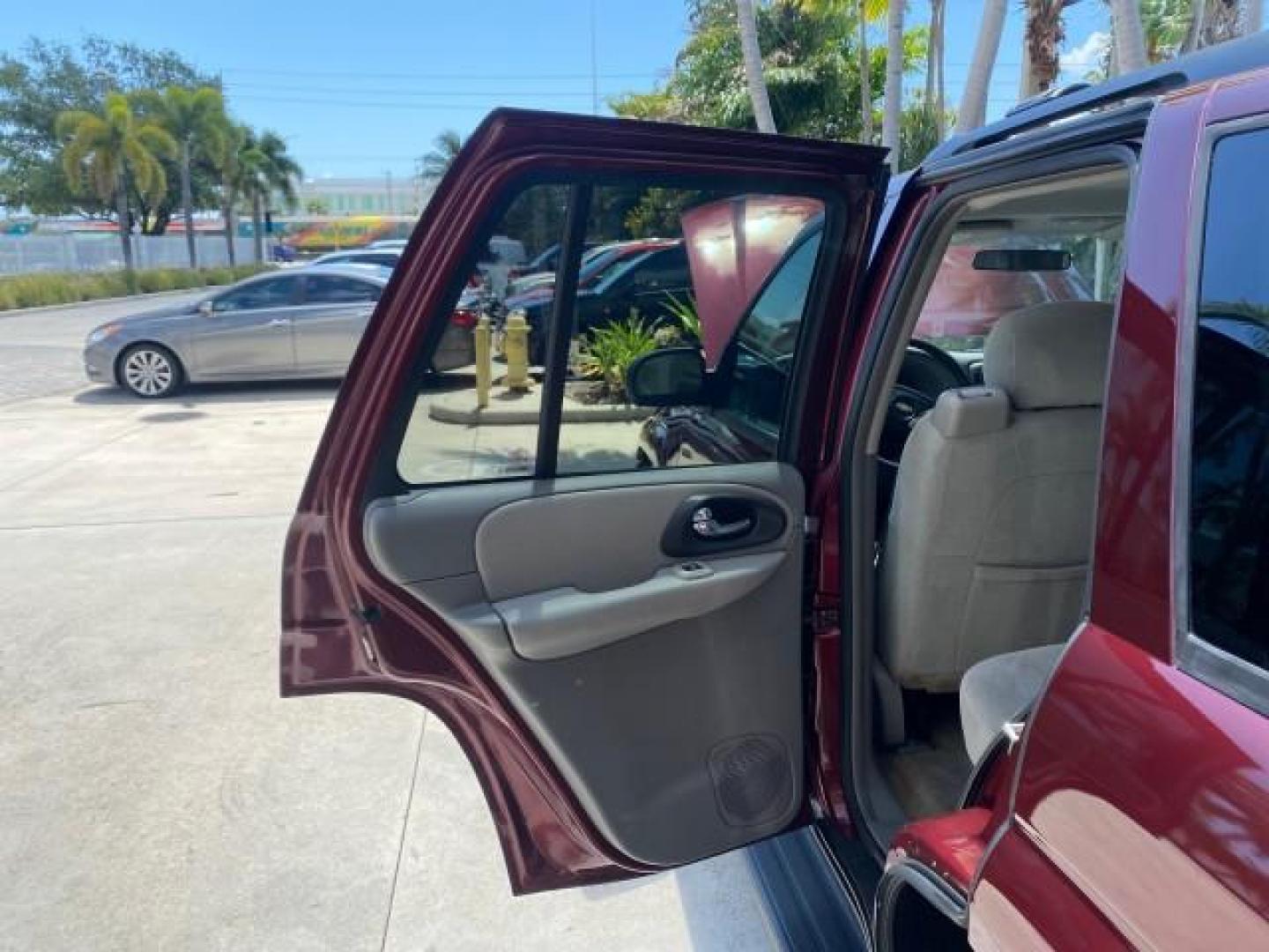 2005 Majestic Red Metallic /Light Gray Chevrolet TrailBlazer LS 39 SERVICES 1 OWNER (1GNDS13SX52) with an 4.2L Vortec 4200 SFI I6 Engine engine, Automatic transmission, located at 4701 North Dixie Hwy, Pompano Beach, FL, 33064, (954) 422-2889, 26.240938, -80.123474 - OUR WEBPAGE FLORIDACARS1.COM HAS OVER 100 PHOTOS AND FREE CARFAX LINK 2005 CHEVROLET TRAILBLAZER LS VIN: 1GNDS13SX52293455 1 G N D S 1 3 S X 5 2 2 9 3 4 5 5 4 DOOR WAGON/SPORT UTILITY 4.2L I6 F GASOLINE REAR WHEEL DRIVE TIRES LOOK NEW! Top Features Alloy Wheels Running Boards Cloth Seats Tow Hitch C - Photo#13