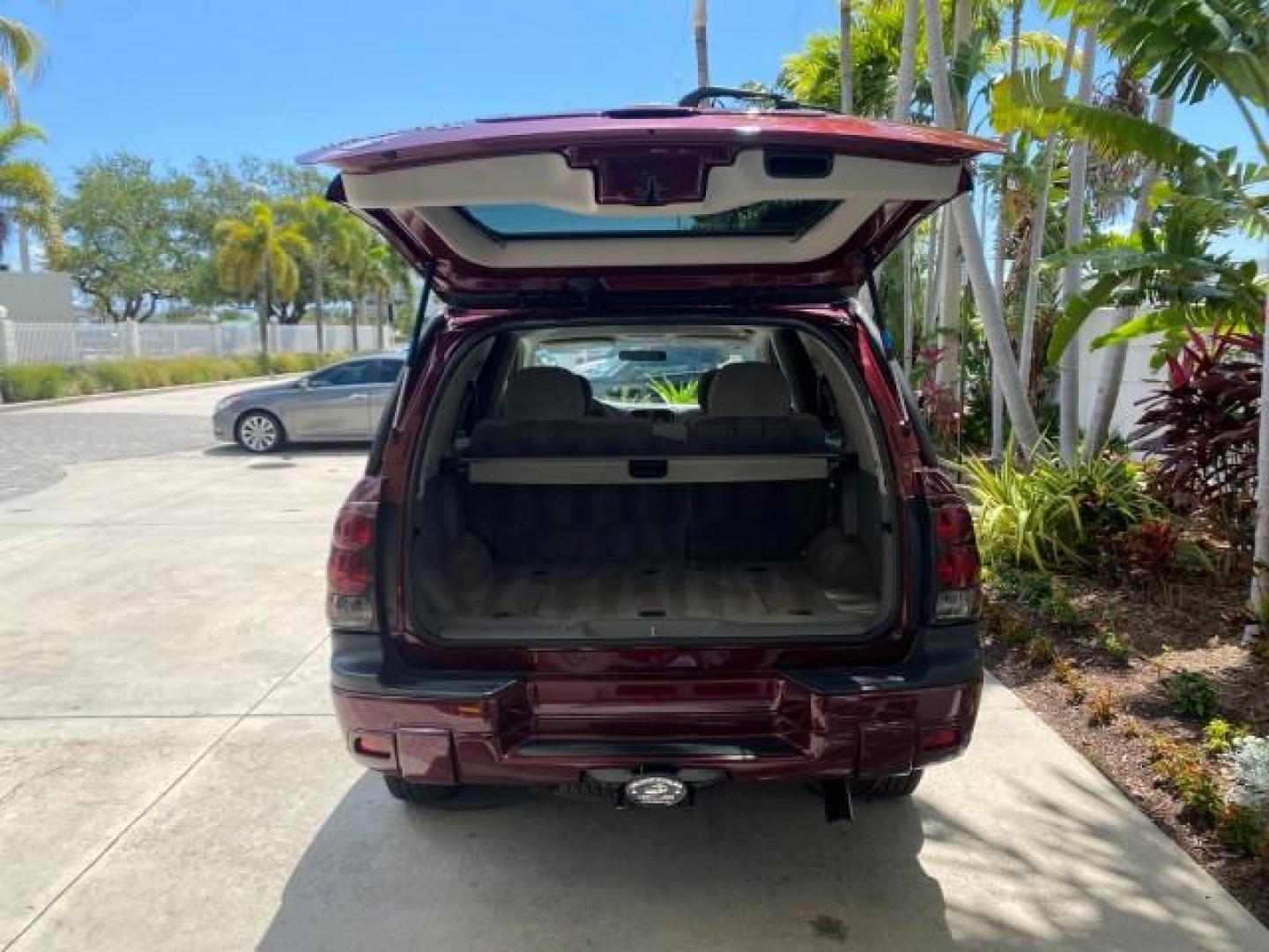2005 Majestic Red Metallic /Light Gray Chevrolet TrailBlazer LS 39 SERVICES 1 OWNER (1GNDS13SX52) with an 4.2L Vortec 4200 SFI I6 Engine engine, Automatic transmission, located at 4701 North Dixie Hwy, Pompano Beach, FL, 33064, (954) 422-2889, 26.240938, -80.123474 - OUR WEBPAGE FLORIDACARS1.COM HAS OVER 100 PHOTOS AND FREE CARFAX LINK 2005 CHEVROLET TRAILBLAZER LS VIN: 1GNDS13SX52293455 1 G N D S 1 3 S X 5 2 2 9 3 4 5 5 4 DOOR WAGON/SPORT UTILITY 4.2L I6 F GASOLINE REAR WHEEL DRIVE TIRES LOOK NEW! Top Features Alloy Wheels Running Boards Cloth Seats Tow Hitch C - Photo#79