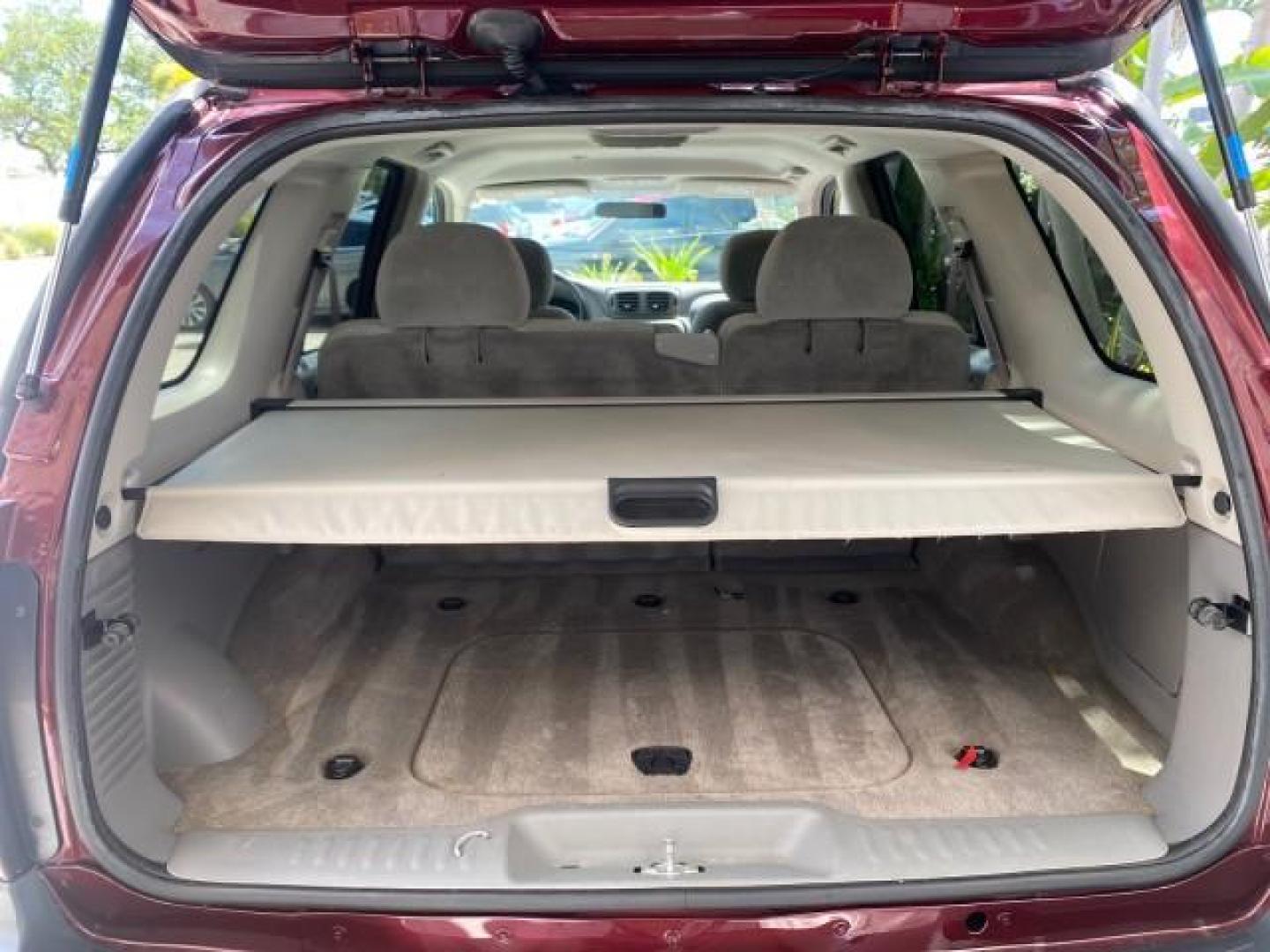 2005 Majestic Red Metallic /Light Gray Chevrolet TrailBlazer LS 39 SERVICES 1 OWNER (1GNDS13SX52) with an 4.2L Vortec 4200 SFI I6 Engine engine, Automatic transmission, located at 4701 North Dixie Hwy, Pompano Beach, FL, 33064, (954) 422-2889, 26.240938, -80.123474 - OUR WEBPAGE FLORIDACARS1.COM HAS OVER 100 PHOTOS AND FREE CARFAX LINK 2005 CHEVROLET TRAILBLAZER LS VIN: 1GNDS13SX52293455 1 G N D S 1 3 S X 5 2 2 9 3 4 5 5 4 DOOR WAGON/SPORT UTILITY 4.2L I6 F GASOLINE REAR WHEEL DRIVE TIRES LOOK NEW! Top Features Alloy Wheels Running Boards Cloth Seats Tow Hitch C - Photo#82