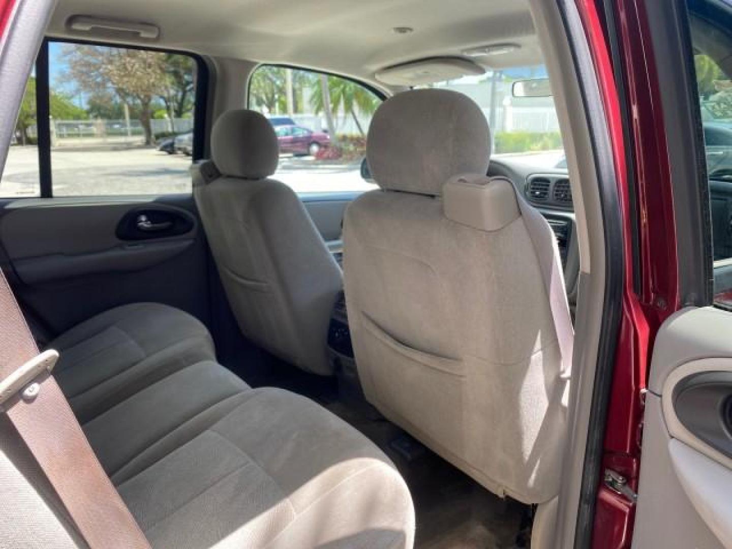 2005 Majestic Red Metallic /Light Gray Chevrolet TrailBlazer LS 39 SERVICES 1 OWNER (1GNDS13SX52) with an 4.2L Vortec 4200 SFI I6 Engine engine, Automatic transmission, located at 4701 North Dixie Hwy, Pompano Beach, FL, 33064, (954) 422-2889, 26.240938, -80.123474 - OUR WEBPAGE FLORIDACARS1.COM HAS OVER 100 PHOTOS AND FREE CARFAX LINK 2005 CHEVROLET TRAILBLAZER LS VIN: 1GNDS13SX52293455 1 G N D S 1 3 S X 5 2 2 9 3 4 5 5 4 DOOR WAGON/SPORT UTILITY 4.2L I6 F GASOLINE REAR WHEEL DRIVE TIRES LOOK NEW! Top Features Alloy Wheels Running Boards Cloth Seats Tow Hitch C - Photo#89