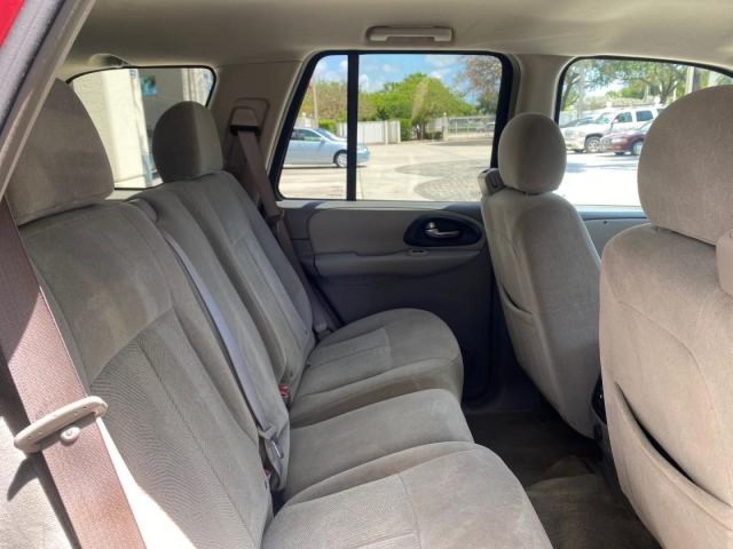 2005 Majestic Red Metallic /Light Gray Chevrolet TrailBlazer LS 39 SERVICES 1 OWNER (1GNDS13SX52) with an 4.2L Vortec 4200 SFI I6 Engine engine, Automatic transmission, located at 4701 North Dixie Hwy, Pompano Beach, FL, 33064, (954) 422-2889, 26.240938, -80.123474 - OUR WEBPAGE FLORIDACARS1.COM HAS OVER 100 PHOTOS AND FREE CARFAX LINK 2005 CHEVROLET TRAILBLAZER LS VIN: 1GNDS13SX52293455 1 G N D S 1 3 S X 5 2 2 9 3 4 5 5 4 DOOR WAGON/SPORT UTILITY 4.2L I6 F GASOLINE REAR WHEEL DRIVE TIRES LOOK NEW! Top Features Alloy Wheels Running Boards Cloth Seats Tow Hitch C - Photo#90