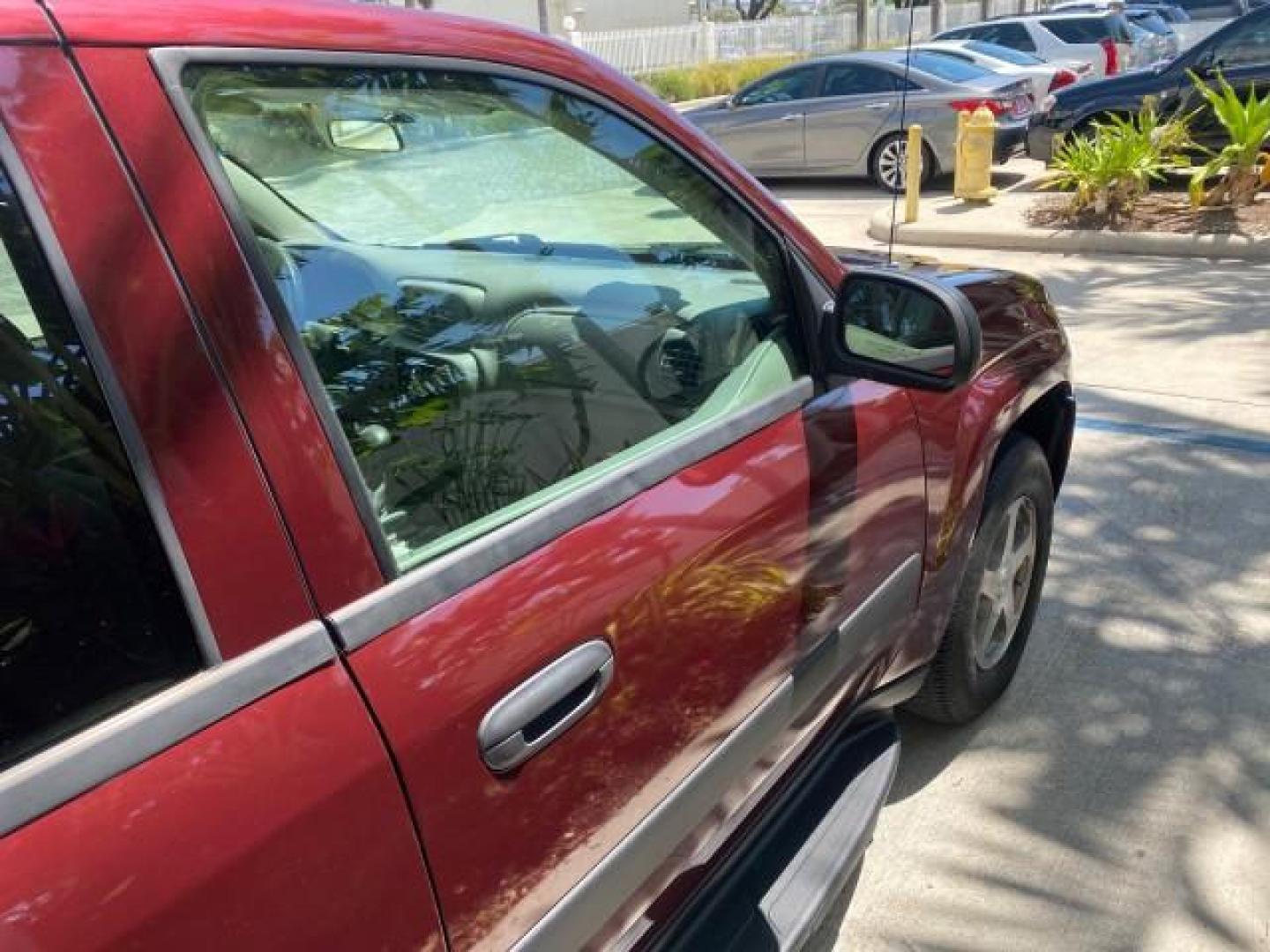 2005 Majestic Red Metallic /Light Gray Chevrolet TrailBlazer LS 39 SERVICES 1 OWNER (1GNDS13SX52) with an 4.2L Vortec 4200 SFI I6 Engine engine, Automatic transmission, located at 4701 North Dixie Hwy, Pompano Beach, FL, 33064, (954) 422-2889, 26.240938, -80.123474 - OUR WEBPAGE FLORIDACARS1.COM HAS OVER 100 PHOTOS AND FREE CARFAX LINK 2005 CHEVROLET TRAILBLAZER LS VIN: 1GNDS13SX52293455 1 G N D S 1 3 S X 5 2 2 9 3 4 5 5 4 DOOR WAGON/SPORT UTILITY 4.2L I6 F GASOLINE REAR WHEEL DRIVE TIRES LOOK NEW! Top Features Alloy Wheels Running Boards Cloth Seats Tow Hitch C - Photo#93