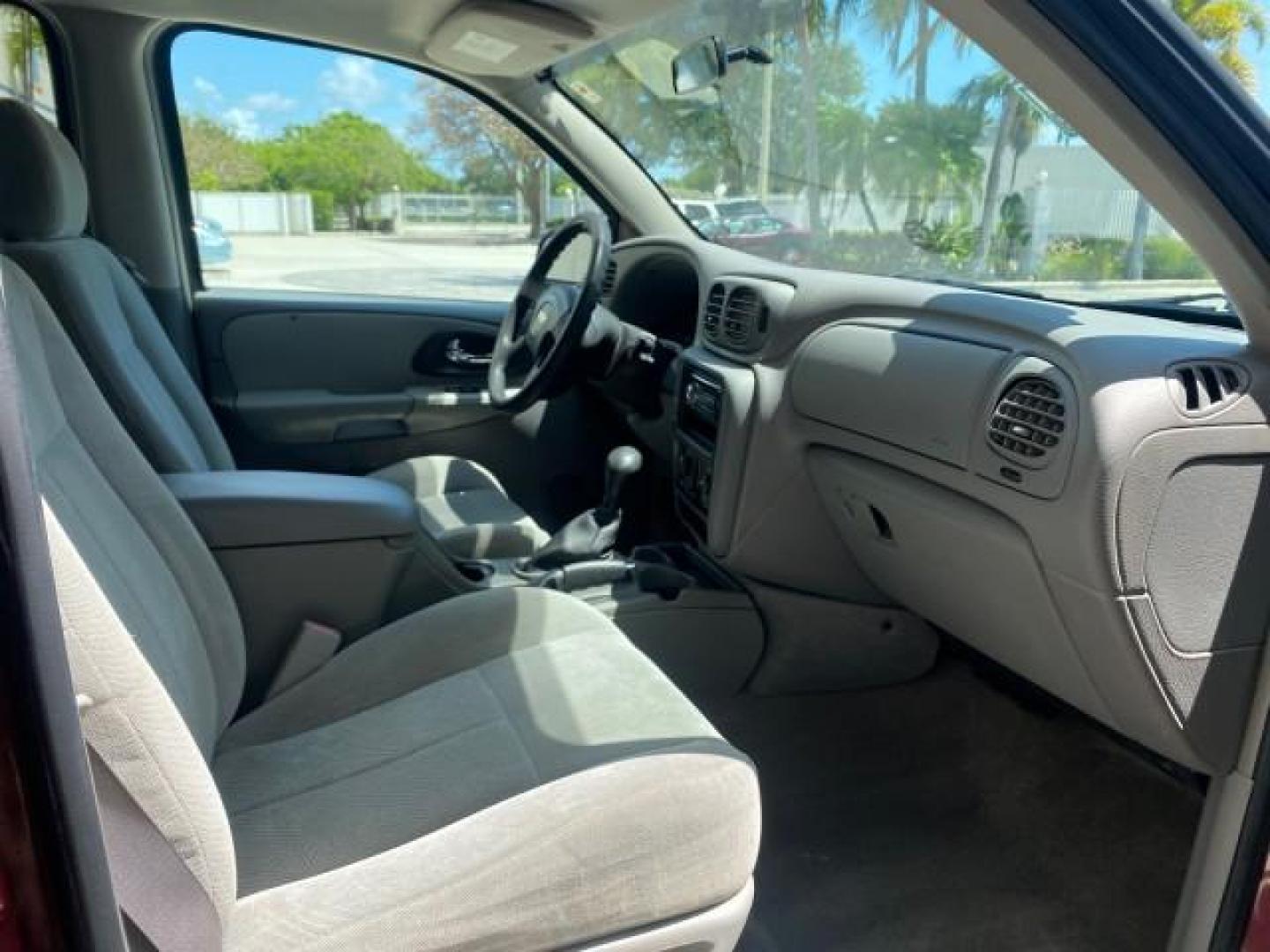 2005 Majestic Red Metallic /Light Gray Chevrolet TrailBlazer LS 39 SERVICES 1 OWNER (1GNDS13SX52) with an 4.2L Vortec 4200 SFI I6 Engine engine, Automatic transmission, located at 4701 North Dixie Hwy, Pompano Beach, FL, 33064, (954) 422-2889, 26.240938, -80.123474 - OUR WEBPAGE FLORIDACARS1.COM HAS OVER 100 PHOTOS AND FREE CARFAX LINK 2005 CHEVROLET TRAILBLAZER LS VIN: 1GNDS13SX52293455 1 G N D S 1 3 S X 5 2 2 9 3 4 5 5 4 DOOR WAGON/SPORT UTILITY 4.2L I6 F GASOLINE REAR WHEEL DRIVE TIRES LOOK NEW! Top Features Alloy Wheels Running Boards Cloth Seats Tow Hitch C - Photo#99