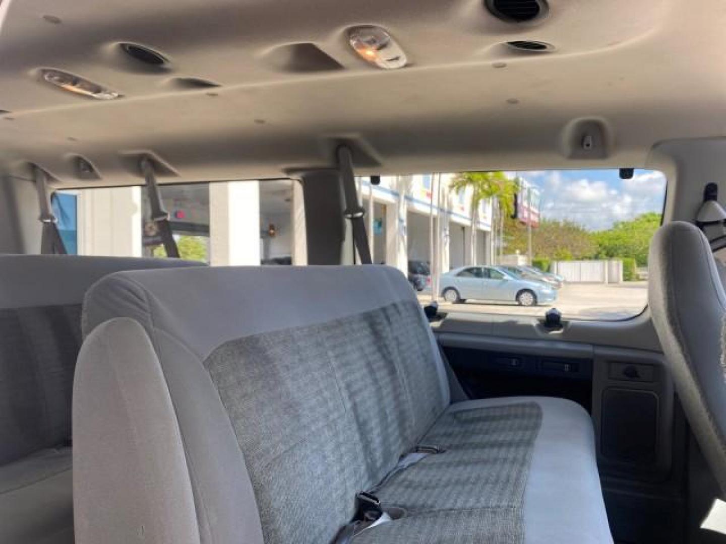 2005 Silver Metallic /Medium Flint Ford Econoline Wagon XLT E350 15 PASS LOW MILES 64,506 (1FBSS31L65H) with an 5.4L EFI V8 Engine engine, Automatic transmission, located at 4701 North Dixie Hwy, Pompano Beach, FL, 33064, (954) 422-2889, 26.240938, -80.123474 - OUR WEBPAGE FLORIDACARS1.COM HAS OVER 100 PHOTOS AND FREE CARFAX LINK 2005 FORD E-SERIES E-350 SD XLT WE HAVE 4 NEW TIRES INCLUDED VIN: 1FBSS31L65HA83248 1 F B S S 3 1 L 6 5 H A 8 3 2 4 8 VAN 5.4L V8 F TOW PKG WE ADDED NEW CLOTH HEADLINER SAGGING FROM AGE GASOLINE REAR WHEEL DRIVE Top Features Cloth - Photo#14