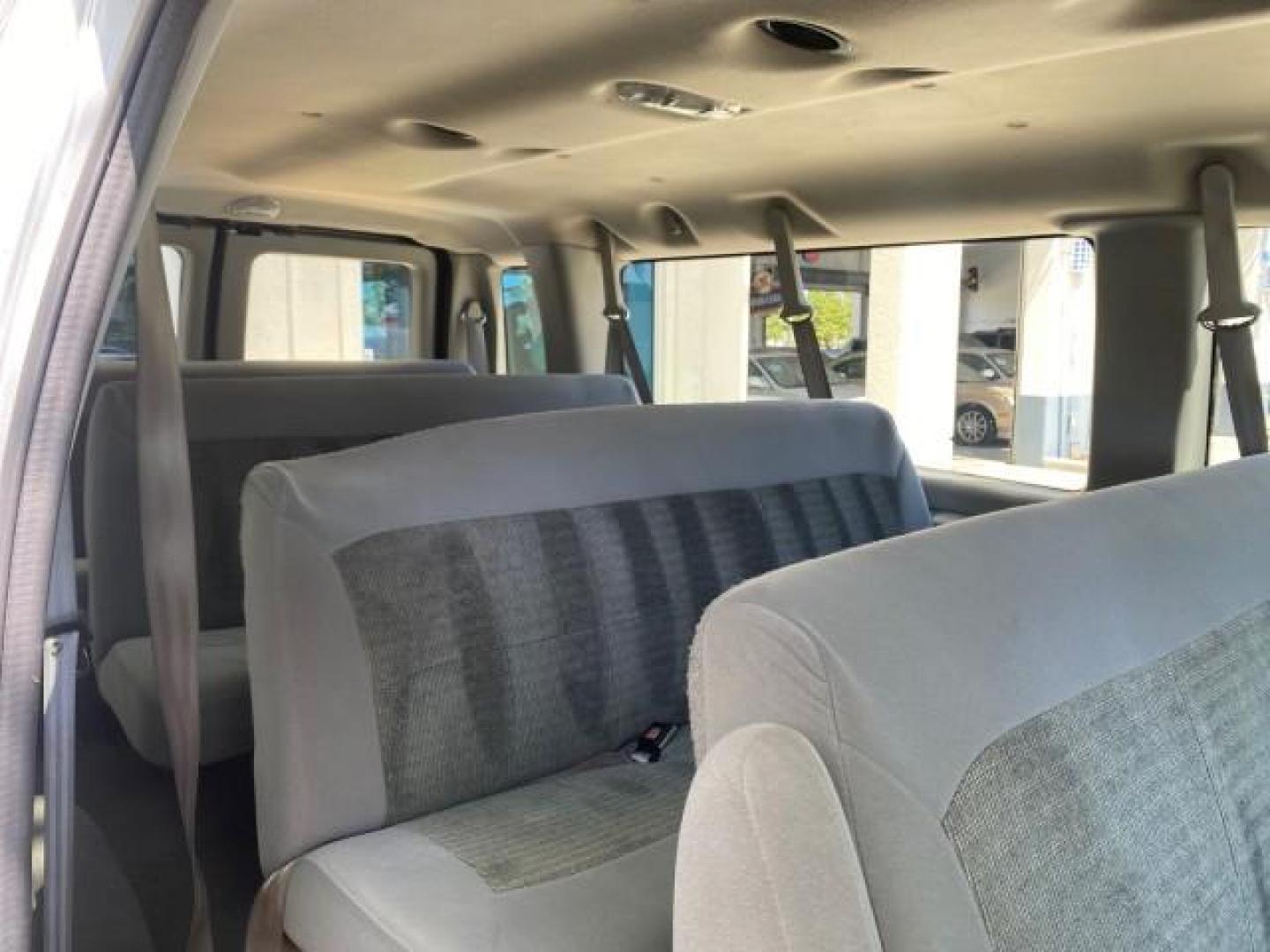 2005 Silver Metallic /Medium Flint Ford Econoline Wagon XLT E350 15 PASS LOW MILES 64,506 (1FBSS31L65H) with an 5.4L EFI V8 Engine engine, Automatic transmission, located at 4701 North Dixie Hwy, Pompano Beach, FL, 33064, (954) 422-2889, 26.240938, -80.123474 - OUR WEBPAGE FLORIDACARS1.COM HAS OVER 100 PHOTOS AND FREE CARFAX LINK 2005 FORD E-SERIES E-350 SD XLT WE HAVE 4 NEW TIRES INCLUDED VIN: 1FBSS31L65HA83248 1 F B S S 3 1 L 6 5 H A 8 3 2 4 8 VAN 5.4L V8 F TOW PKG WE ADDED NEW CLOTH HEADLINER SAGGING FROM AGE GASOLINE REAR WHEEL DRIVE Top Features Cloth - Photo#80