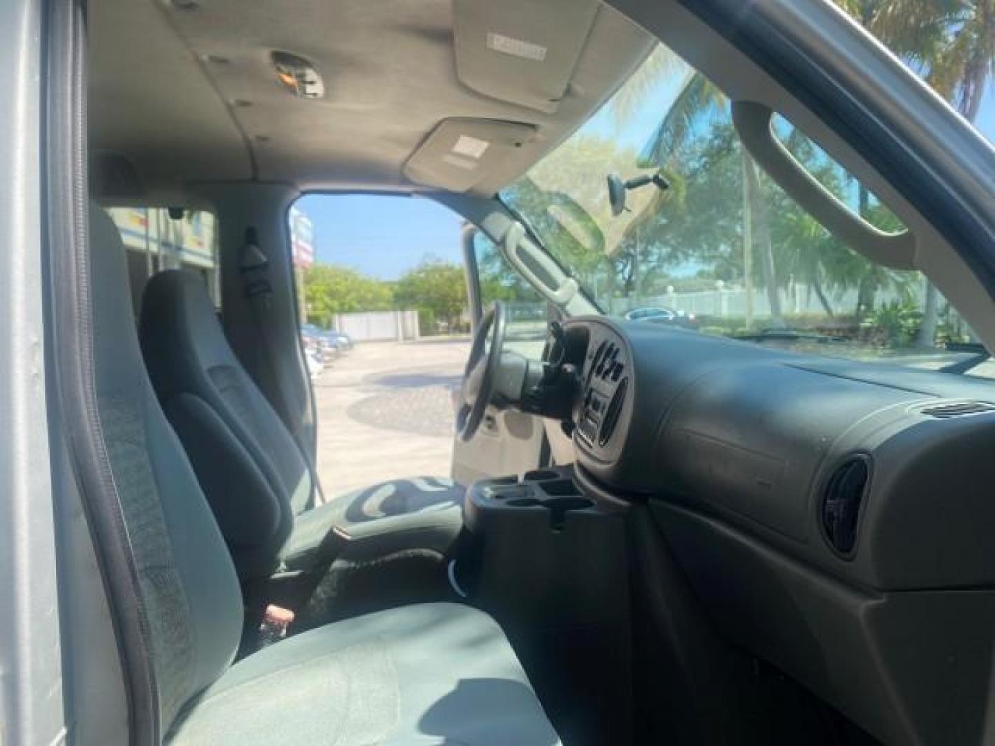 2005 Silver Metallic /Medium Flint Ford Econoline Wagon XLT E350 15 PASS LOW MILES 64,506 (1FBSS31L65H) with an 5.4L EFI V8 Engine engine, Automatic transmission, located at 4701 North Dixie Hwy, Pompano Beach, FL, 33064, (954) 422-2889, 26.240938, -80.123474 - OUR WEBPAGE FLORIDACARS1.COM HAS OVER 100 PHOTOS AND FREE CARFAX LINK 2005 FORD E-SERIES E-350 SD XLT WE HAVE 4 NEW TIRES INCLUDED VIN: 1FBSS31L65HA83248 1 F B S S 3 1 L 6 5 H A 8 3 2 4 8 VAN 5.4L V8 F TOW PKG WE ADDED NEW CLOTH HEADLINER SAGGING FROM AGE GASOLINE REAR WHEEL DRIVE Top Features Cloth - Photo#12