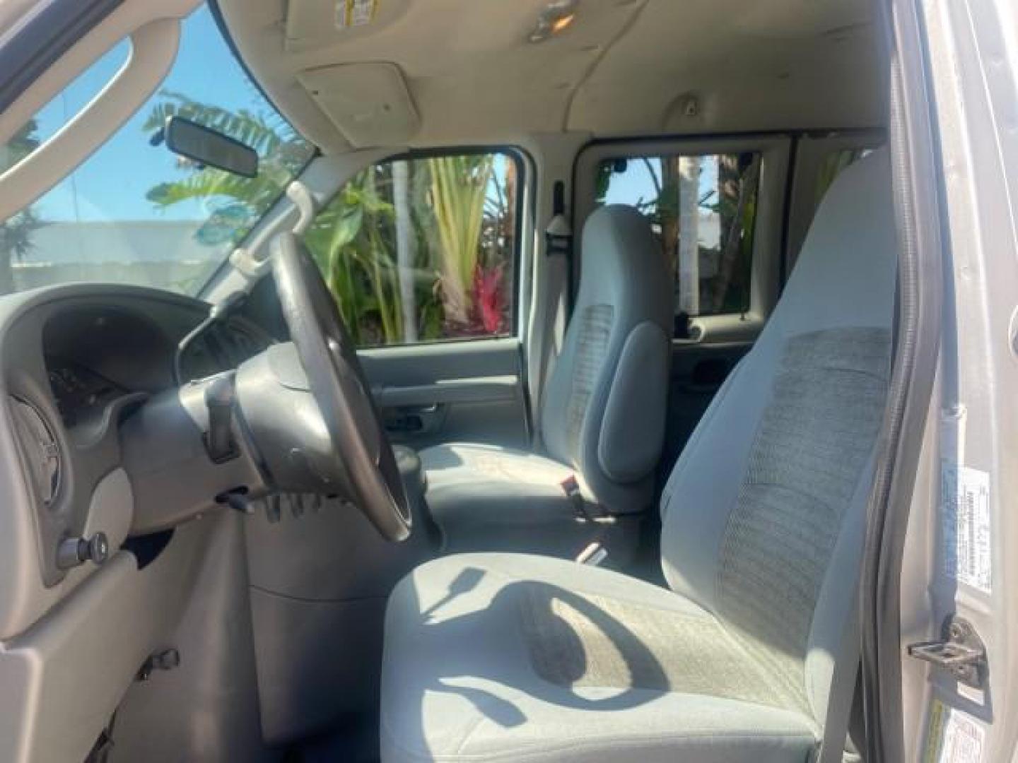 2005 Silver Metallic /Medium Flint Ford Econoline Wagon XLT E350 15 PASS LOW MILES 64,506 (1FBSS31L65H) with an 5.4L EFI V8 Engine engine, Automatic transmission, located at 4701 North Dixie Hwy, Pompano Beach, FL, 33064, (954) 422-2889, 26.240938, -80.123474 - OUR WEBPAGE FLORIDACARS1.COM HAS OVER 100 PHOTOS AND FREE CARFAX LINK 2005 FORD E-SERIES E-350 SD XLT WE HAVE 4 NEW TIRES INCLUDED VIN: 1FBSS31L65HA83248 1 F B S S 3 1 L 6 5 H A 8 3 2 4 8 VAN 5.4L V8 F TOW PKG WE ADDED NEW CLOTH HEADLINER SAGGING FROM AGE GASOLINE REAR WHEEL DRIVE Top Features Cloth - Photo#33