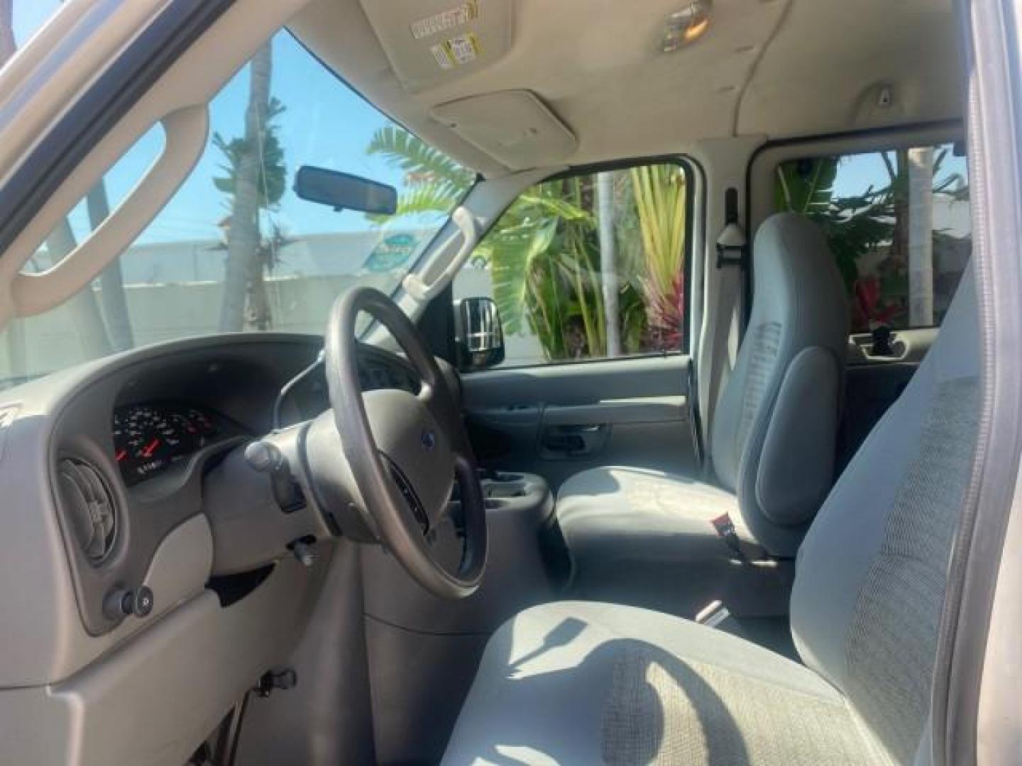2005 Silver Metallic /Medium Flint Ford Econoline Wagon XLT E350 15 PASS LOW MILES 64,506 (1FBSS31L65H) with an 5.4L EFI V8 Engine engine, Automatic transmission, located at 4701 North Dixie Hwy, Pompano Beach, FL, 33064, (954) 422-2889, 26.240938, -80.123474 - OUR WEBPAGE FLORIDACARS1.COM HAS OVER 100 PHOTOS AND FREE CARFAX LINK 2005 FORD E-SERIES E-350 SD XLT WE HAVE 4 NEW TIRES INCLUDED VIN: 1FBSS31L65HA83248 1 F B S S 3 1 L 6 5 H A 8 3 2 4 8 VAN 5.4L V8 F TOW PKG WE ADDED NEW CLOTH HEADLINER SAGGING FROM AGE GASOLINE REAR WHEEL DRIVE Top Features Cloth - Photo#34