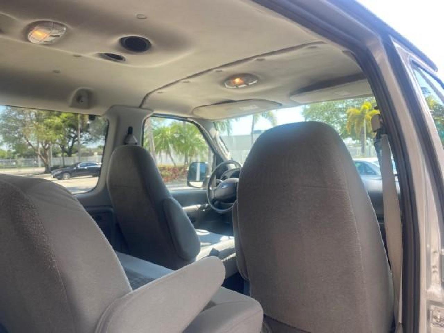 2005 Silver Metallic /Medium Flint Ford Econoline Wagon XLT E350 15 PASS LOW MILES 64,506 (1FBSS31L65H) with an 5.4L EFI V8 Engine engine, Automatic transmission, located at 4701 North Dixie Hwy, Pompano Beach, FL, 33064, (954) 422-2889, 26.240938, -80.123474 - OUR WEBPAGE FLORIDACARS1.COM HAS OVER 100 PHOTOS AND FREE CARFAX LINK 2005 FORD E-SERIES E-350 SD XLT WE HAVE 4 NEW TIRES INCLUDED VIN: 1FBSS31L65HA83248 1 F B S S 3 1 L 6 5 H A 8 3 2 4 8 VAN 5.4L V8 F TOW PKG WE ADDED NEW CLOTH HEADLINER SAGGING FROM AGE GASOLINE REAR WHEEL DRIVE Top Features Cloth - Photo#73