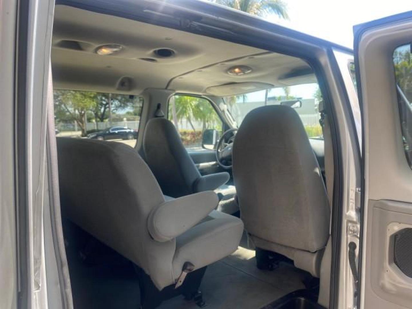 2005 Silver Metallic /Medium Flint Ford Econoline Wagon XLT E350 15 PASS LOW MILES 64,506 (1FBSS31L65H) with an 5.4L EFI V8 Engine engine, Automatic transmission, located at 4701 North Dixie Hwy, Pompano Beach, FL, 33064, (954) 422-2889, 26.240938, -80.123474 - OUR WEBPAGE FLORIDACARS1.COM HAS OVER 100 PHOTOS AND FREE CARFAX LINK 2005 FORD E-SERIES E-350 SD XLT WE HAVE 4 NEW TIRES INCLUDED VIN: 1FBSS31L65HA83248 1 F B S S 3 1 L 6 5 H A 8 3 2 4 8 VAN 5.4L V8 F TOW PKG WE ADDED NEW CLOTH HEADLINER SAGGING FROM AGE GASOLINE REAR WHEEL DRIVE Top Features Cloth - Photo#75