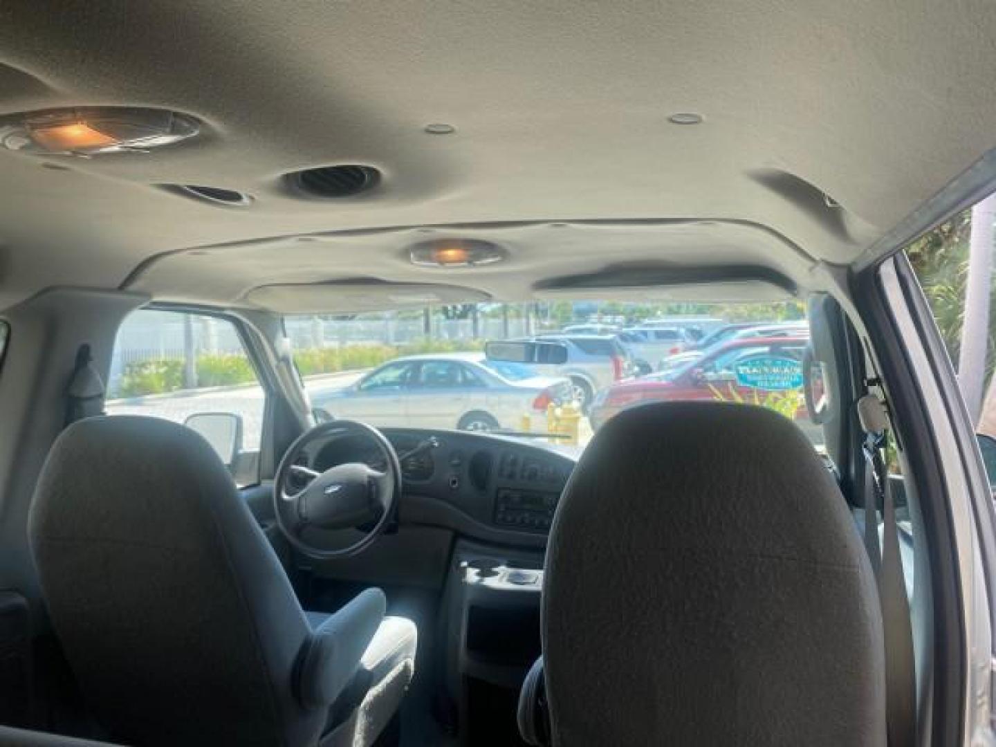 2005 Silver Metallic /Medium Flint Ford Econoline Wagon XLT E350 15 PASS LOW MILES 64,506 (1FBSS31L65H) with an 5.4L EFI V8 Engine engine, Automatic transmission, located at 4701 North Dixie Hwy, Pompano Beach, FL, 33064, (954) 422-2889, 26.240938, -80.123474 - OUR WEBPAGE FLORIDACARS1.COM HAS OVER 100 PHOTOS AND FREE CARFAX LINK 2005 FORD E-SERIES E-350 SD XLT WE HAVE 4 NEW TIRES INCLUDED VIN: 1FBSS31L65HA83248 1 F B S S 3 1 L 6 5 H A 8 3 2 4 8 VAN 5.4L V8 F TOW PKG WE ADDED NEW CLOTH HEADLINER SAGGING FROM AGE GASOLINE REAR WHEEL DRIVE Top Features Cloth - Photo#85