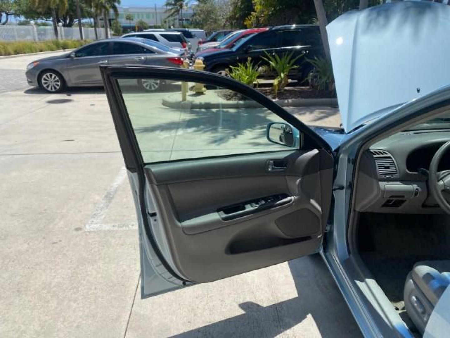 2005 Sky Blue Pearl /Stone Toyota Camry LE FL LOW MILES SUNROOF LEATHER (4T1BE32K25U) with an 2.4L DOHC SEFI Vvti 16-Valve 4-Cyl Engine engine, Automatic transmission, located at 4701 North Dixie Hwy, Pompano Beach, FL, 33064, (954) 422-2889, 26.240938, -80.123474 - OUR WEBPAGE FLORIDACARS1.COM HAS OVER 100 PHOTOS AND FREE CARFAX LINK 2005 TOYOTA CAMRY LE SUNROOF LEATHER VIN: 4T1BE32K25U531416 4 T 1 B E 3 2 K 2 5 U 5 3 1 4 1 6 SEDAN 4 DR 2.4L I4 F DOHC 16V 4 CYL 34 MPG GASOLINE FRONT WHEEL DRIVE Top Features JBL Sound System Leather Seats Basic Features ABS Bra - Photo#9