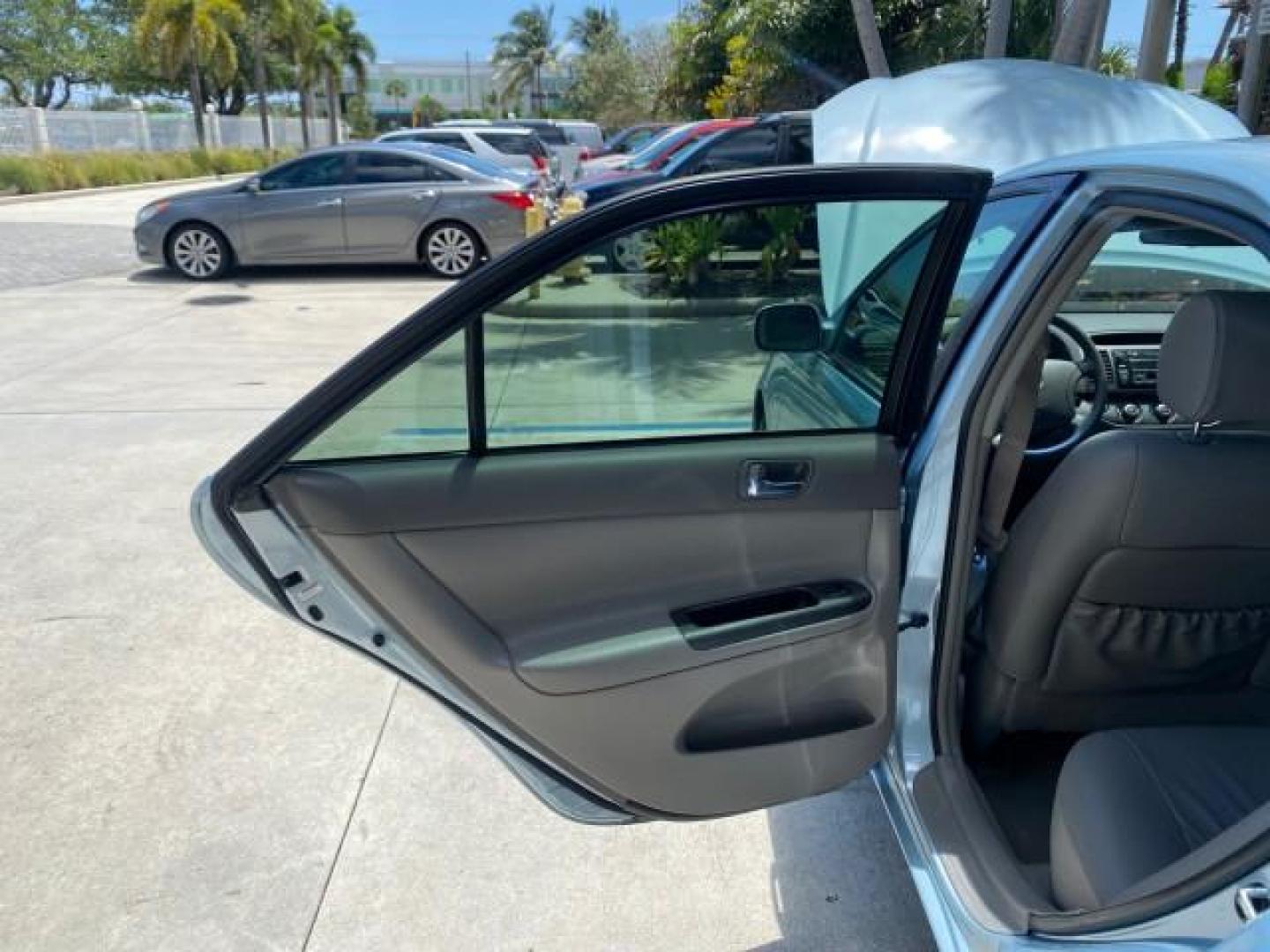 2005 Sky Blue Pearl /Stone Toyota Camry LE FL LOW MILES SUNROOF LEATHER (4T1BE32K25U) with an 2.4L DOHC SEFI Vvti 16-Valve 4-Cyl Engine engine, Automatic transmission, located at 4701 North Dixie Hwy, Pompano Beach, FL, 33064, (954) 422-2889, 26.240938, -80.123474 - OUR WEBPAGE FLORIDACARS1.COM HAS OVER 100 PHOTOS AND FREE CARFAX LINK 2005 TOYOTA CAMRY LE SUNROOF LEATHER VIN: 4T1BE32K25U531416 4 T 1 B E 3 2 K 2 5 U 5 3 1 4 1 6 SEDAN 4 DR 2.4L I4 F DOHC 16V 4 CYL 34 MPG GASOLINE FRONT WHEEL DRIVE Top Features JBL Sound System Leather Seats Basic Features ABS Bra - Photo#13