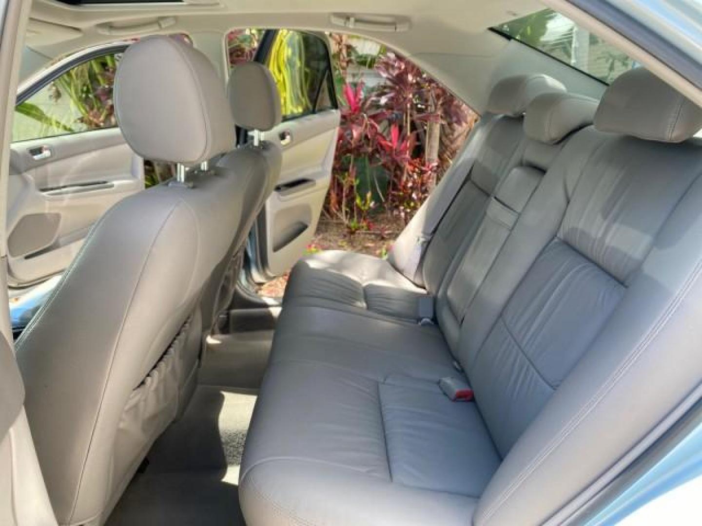 2005 Sky Blue Pearl /Stone Toyota Camry LE FL LOW MILES SUNROOF LEATHER (4T1BE32K25U) with an 2.4L DOHC SEFI Vvti 16-Valve 4-Cyl Engine engine, Automatic transmission, located at 4701 North Dixie Hwy, Pompano Beach, FL, 33064, (954) 422-2889, 26.240938, -80.123474 - OUR WEBPAGE FLORIDACARS1.COM HAS OVER 100 PHOTOS AND FREE CARFAX LINK 2005 TOYOTA CAMRY LE SUNROOF LEATHER VIN: 4T1BE32K25U531416 4 T 1 B E 3 2 K 2 5 U 5 3 1 4 1 6 SEDAN 4 DR 2.4L I4 F DOHC 16V 4 CYL 34 MPG GASOLINE FRONT WHEEL DRIVE Top Features JBL Sound System Leather Seats Basic Features ABS Bra - Photo#14