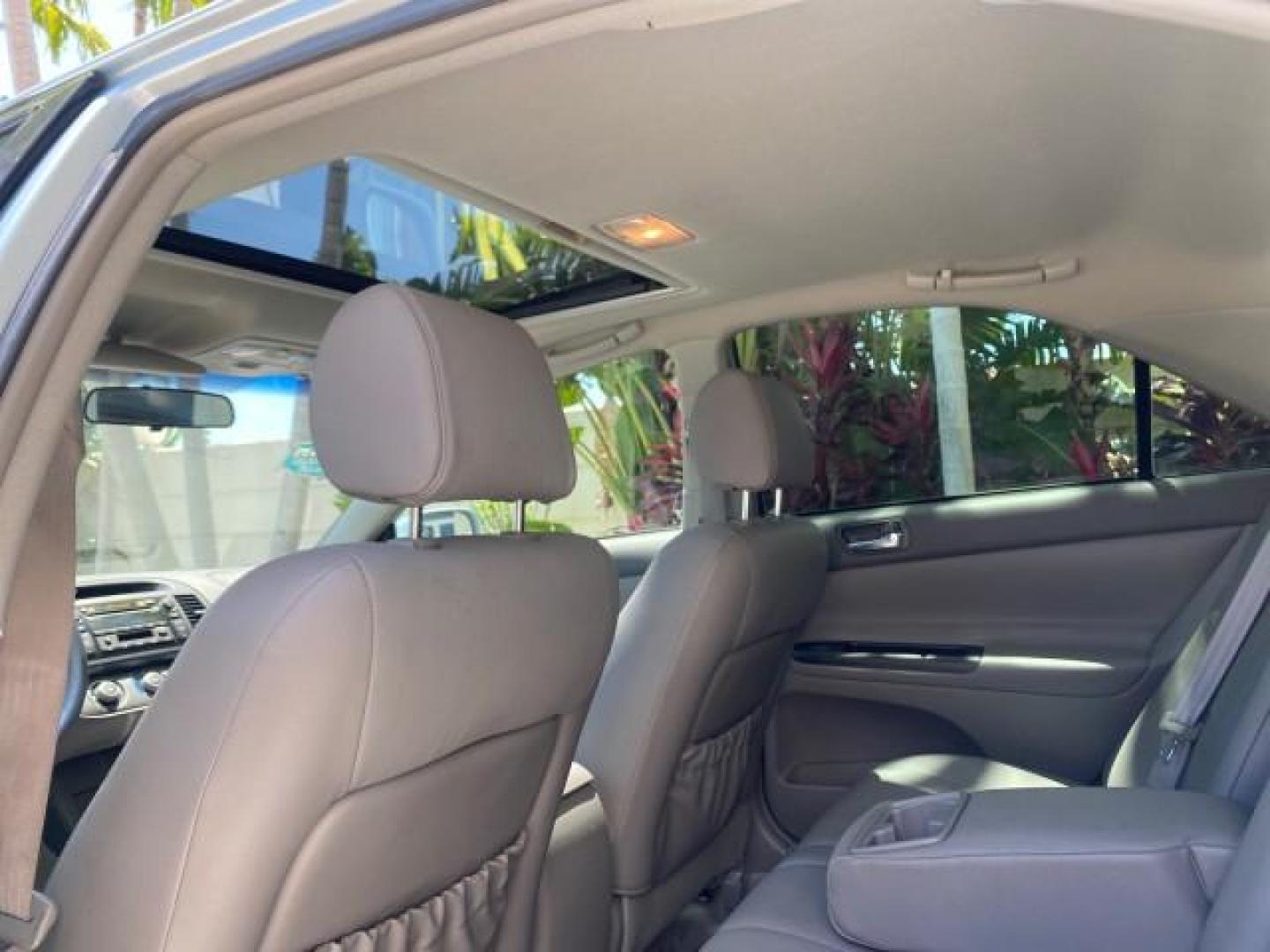 2005 Sky Blue Pearl /Stone Toyota Camry LE FL LOW MILES SUNROOF LEATHER (4T1BE32K25U) with an 2.4L DOHC SEFI Vvti 16-Valve 4-Cyl Engine engine, Automatic transmission, located at 4701 North Dixie Hwy, Pompano Beach, FL, 33064, (954) 422-2889, 26.240938, -80.123474 - OUR WEBPAGE FLORIDACARS1.COM HAS OVER 100 PHOTOS AND FREE CARFAX LINK 2005 TOYOTA CAMRY LE SUNROOF LEATHER VIN: 4T1BE32K25U531416 4 T 1 B E 3 2 K 2 5 U 5 3 1 4 1 6 SEDAN 4 DR 2.4L I4 F DOHC 16V 4 CYL 34 MPG GASOLINE FRONT WHEEL DRIVE Top Features JBL Sound System Leather Seats Basic Features ABS Bra - Photo#64
