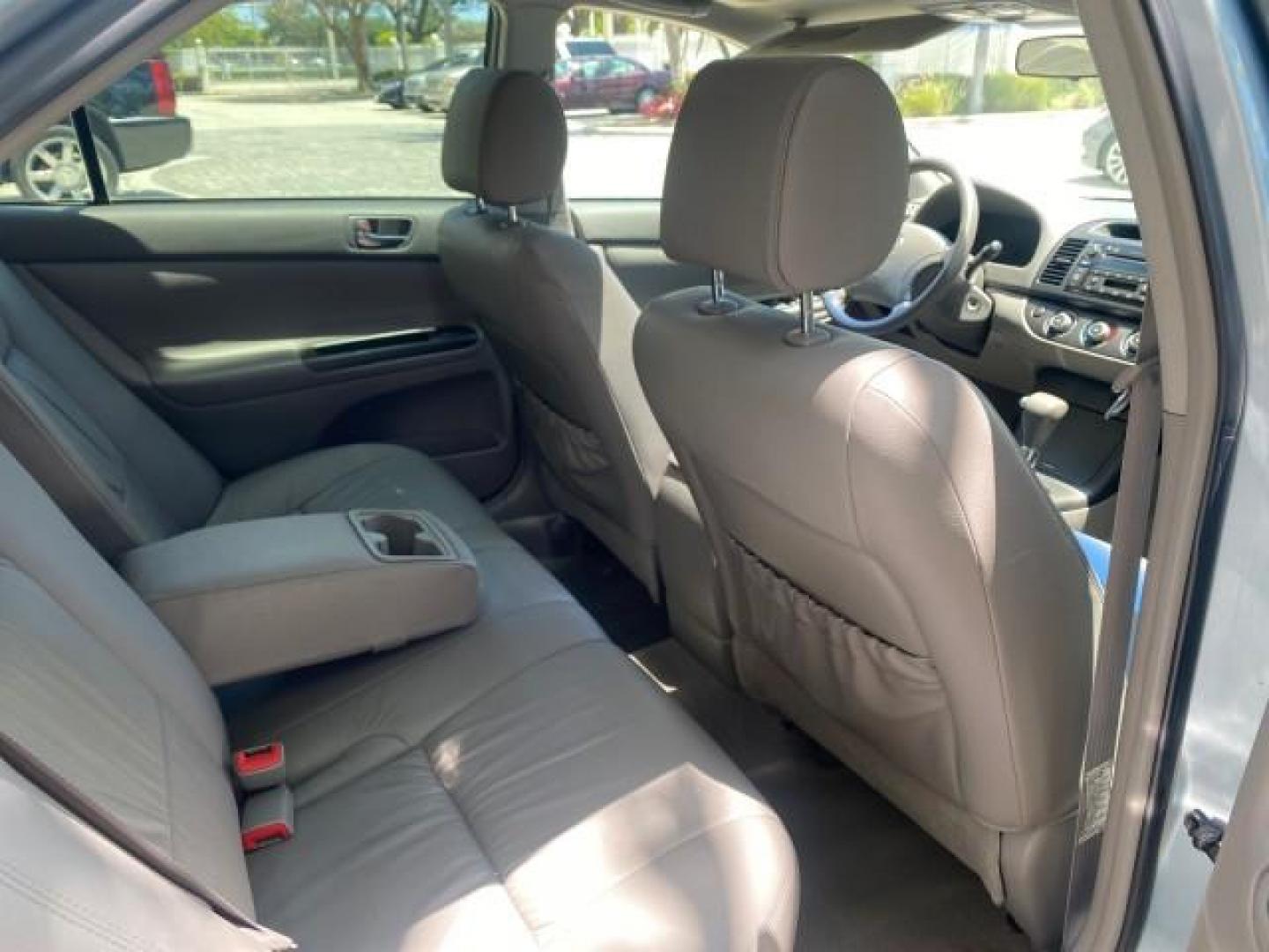 2005 Sky Blue Pearl /Stone Toyota Camry LE FL LOW MILES SUNROOF LEATHER (4T1BE32K25U) with an 2.4L DOHC SEFI Vvti 16-Valve 4-Cyl Engine engine, Automatic transmission, located at 4701 North Dixie Hwy, Pompano Beach, FL, 33064, (954) 422-2889, 26.240938, -80.123474 - OUR WEBPAGE FLORIDACARS1.COM HAS OVER 100 PHOTOS AND FREE CARFAX LINK 2005 TOYOTA CAMRY LE SUNROOF LEATHER VIN: 4T1BE32K25U531416 4 T 1 B E 3 2 K 2 5 U 5 3 1 4 1 6 SEDAN 4 DR 2.4L I4 F DOHC 16V 4 CYL 34 MPG GASOLINE FRONT WHEEL DRIVE Top Features JBL Sound System Leather Seats Basic Features ABS Bra - Photo#85