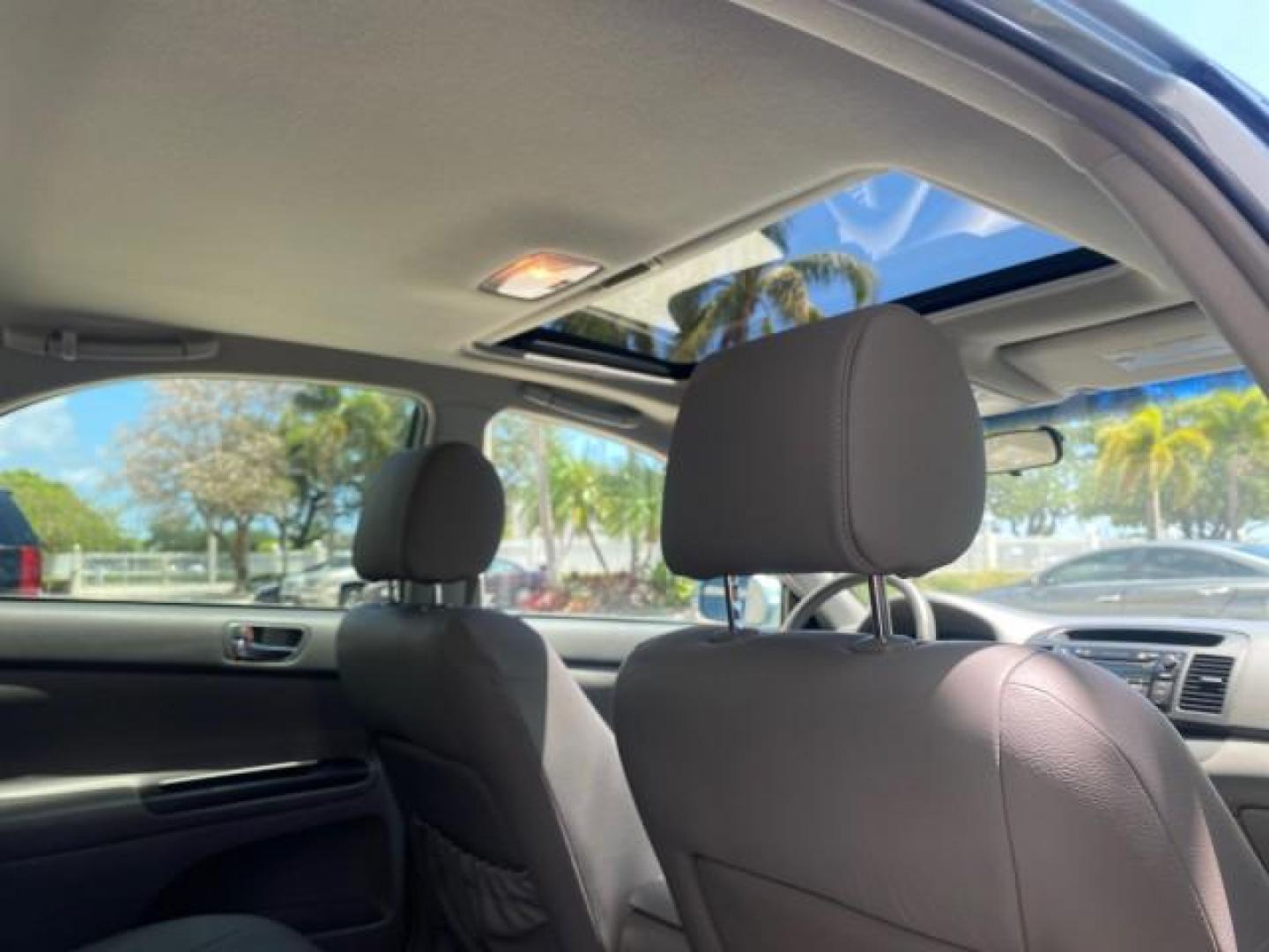 2005 Sky Blue Pearl /Stone Toyota Camry LE FL LOW MILES SUNROOF LEATHER (4T1BE32K25U) with an 2.4L DOHC SEFI Vvti 16-Valve 4-Cyl Engine engine, Automatic transmission, located at 4701 North Dixie Hwy, Pompano Beach, FL, 33064, (954) 422-2889, 26.240938, -80.123474 - OUR WEBPAGE FLORIDACARS1.COM HAS OVER 100 PHOTOS AND FREE CARFAX LINK 2005 TOYOTA CAMRY LE SUNROOF LEATHER VIN: 4T1BE32K25U531416 4 T 1 B E 3 2 K 2 5 U 5 3 1 4 1 6 SEDAN 4 DR 2.4L I4 F DOHC 16V 4 CYL 34 MPG GASOLINE FRONT WHEEL DRIVE Top Features JBL Sound System Leather Seats Basic Features ABS Bra - Photo#86