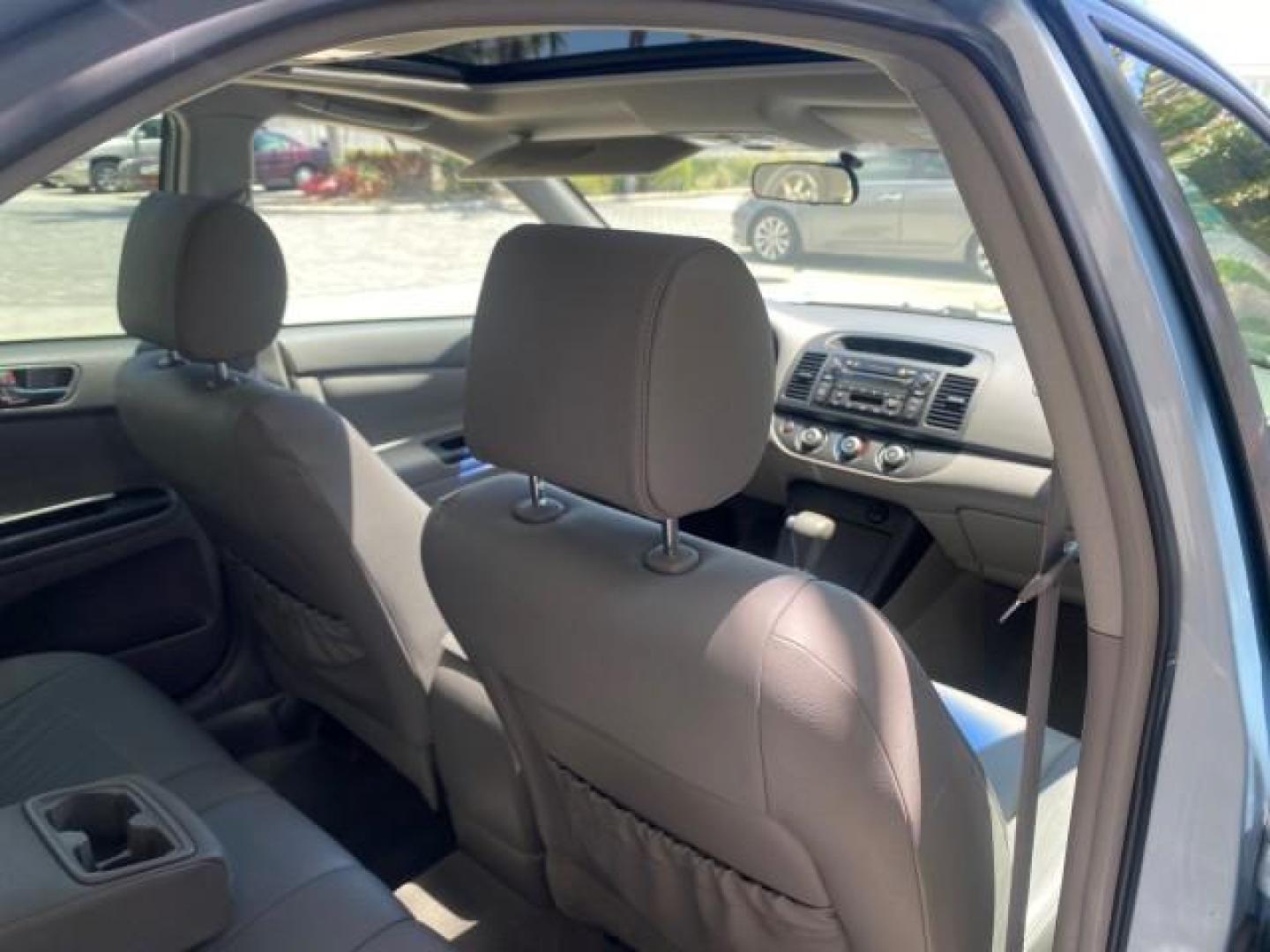 2005 Sky Blue Pearl /Stone Toyota Camry LE FL LOW MILES SUNROOF LEATHER (4T1BE32K25U) with an 2.4L DOHC SEFI Vvti 16-Valve 4-Cyl Engine engine, Automatic transmission, located at 4701 North Dixie Hwy, Pompano Beach, FL, 33064, (954) 422-2889, 26.240938, -80.123474 - OUR WEBPAGE FLORIDACARS1.COM HAS OVER 100 PHOTOS AND FREE CARFAX LINK 2005 TOYOTA CAMRY LE SUNROOF LEATHER VIN: 4T1BE32K25U531416 4 T 1 B E 3 2 K 2 5 U 5 3 1 4 1 6 SEDAN 4 DR 2.4L I4 F DOHC 16V 4 CYL 34 MPG GASOLINE FRONT WHEEL DRIVE Top Features JBL Sound System Leather Seats Basic Features ABS Bra - Photo#88