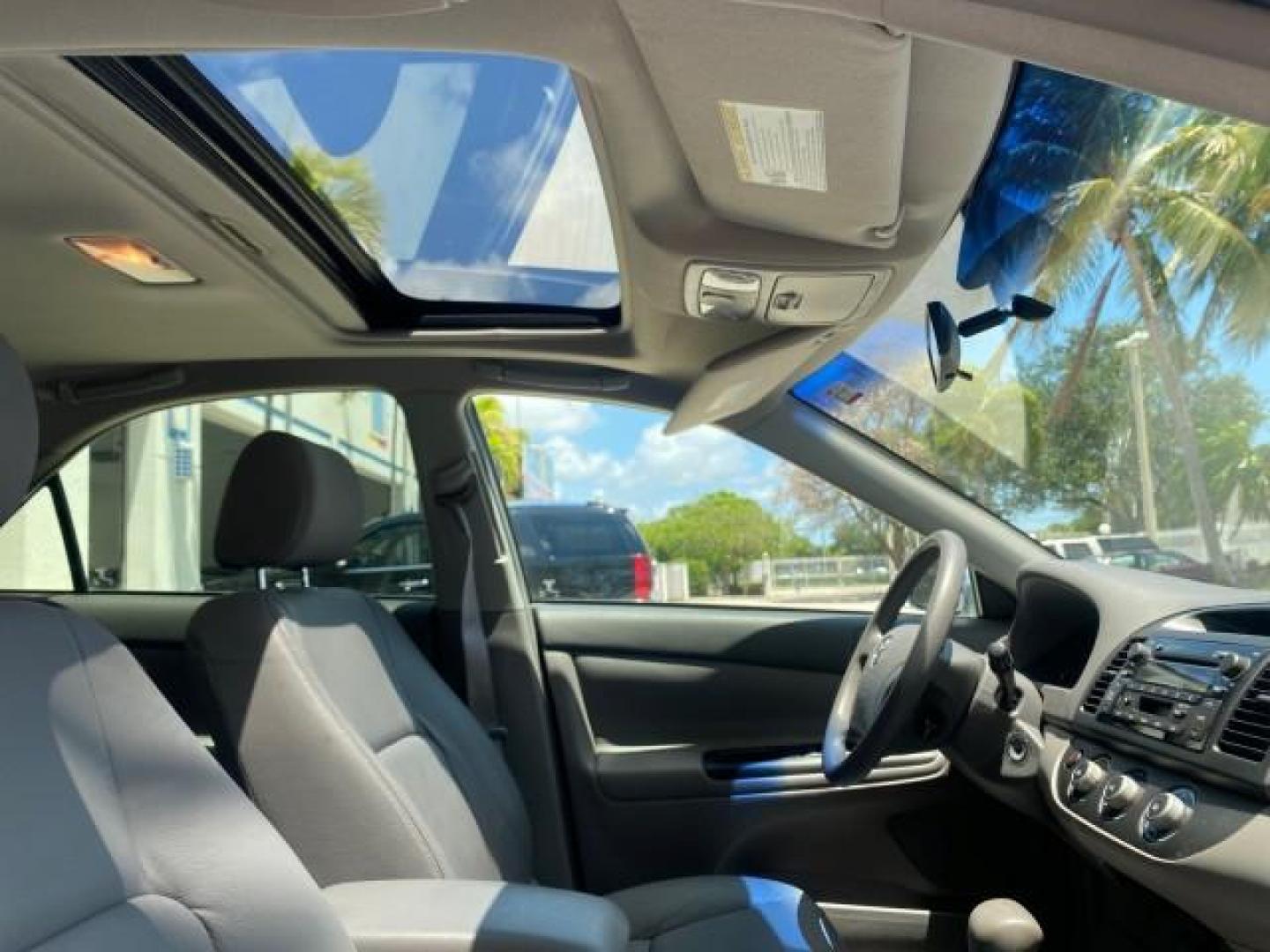 2005 Sky Blue Pearl /Stone Toyota Camry LE FL LOW MILES SUNROOF LEATHER (4T1BE32K25U) with an 2.4L DOHC SEFI Vvti 16-Valve 4-Cyl Engine engine, Automatic transmission, located at 4701 North Dixie Hwy, Pompano Beach, FL, 33064, (954) 422-2889, 26.240938, -80.123474 - OUR WEBPAGE FLORIDACARS1.COM HAS OVER 100 PHOTOS AND FREE CARFAX LINK 2005 TOYOTA CAMRY LE SUNROOF LEATHER VIN: 4T1BE32K25U531416 4 T 1 B E 3 2 K 2 5 U 5 3 1 4 1 6 SEDAN 4 DR 2.4L I4 F DOHC 16V 4 CYL 34 MPG GASOLINE FRONT WHEEL DRIVE Top Features JBL Sound System Leather Seats Basic Features ABS Bra - Photo#94