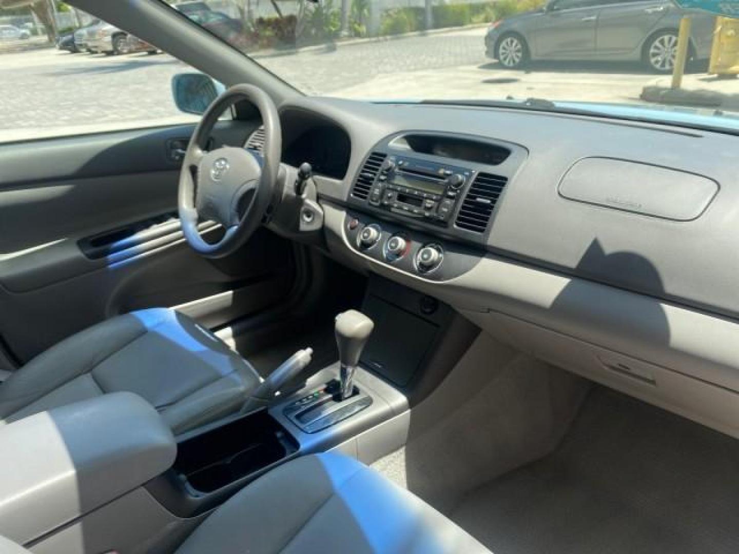 2005 Sky Blue Pearl /Stone Toyota Camry LE FL LOW MILES SUNROOF LEATHER (4T1BE32K25U) with an 2.4L DOHC SEFI Vvti 16-Valve 4-Cyl Engine engine, Automatic transmission, located at 4701 North Dixie Hwy, Pompano Beach, FL, 33064, (954) 422-2889, 26.240938, -80.123474 - OUR WEBPAGE FLORIDACARS1.COM HAS OVER 100 PHOTOS AND FREE CARFAX LINK 2005 TOYOTA CAMRY LE SUNROOF LEATHER VIN: 4T1BE32K25U531416 4 T 1 B E 3 2 K 2 5 U 5 3 1 4 1 6 SEDAN 4 DR 2.4L I4 F DOHC 16V 4 CYL 34 MPG GASOLINE FRONT WHEEL DRIVE Top Features JBL Sound System Leather Seats Basic Features ABS Bra - Photo#95