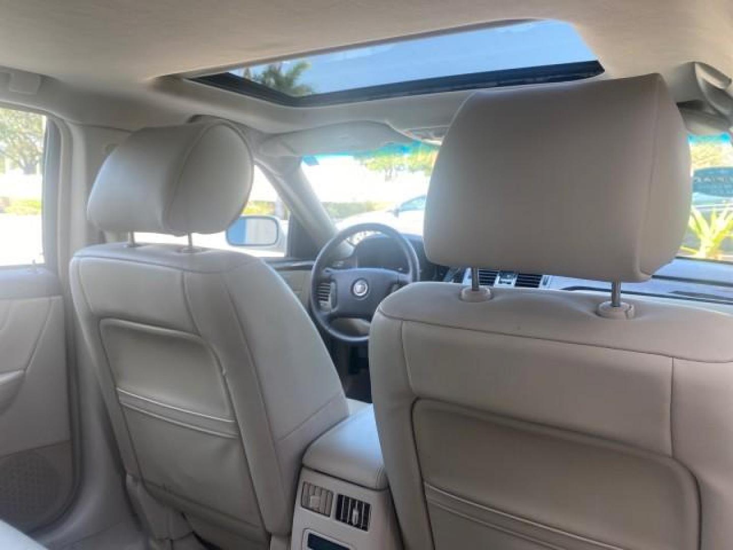 2010 White Diamond Tricoat /Shale/Cocoa Cadillac DTS w/1SC LOW MILES 55,831 FLORIDA (1G6KD5EY9AU) with an Northstar 4.6L DOHC V8 Engine engine, Automatic transmission, located at 4701 North Dixie Hwy, Pompano Beach, FL, 33064, (954) 422-2889, 26.240938, -80.123474 - OUR WEBPAGE FLORIDACARS1.COM HAS OVER 100 PHOTOS AND FREE CARFAX LINK 2010 CADILLAC DTS LUXURY COLLECTION SUNROOF BEAUTIFUL CABRIO VINAL TOP LIKE NEW! ADD $ 5000 PKG! VIN: 1G6KD5EY9AU131997 1 G 6 K D 5 E Y 9 A U 1 3 1 9 9 7 SEDAN 4 DR 4.6L V8 F DOHC 32V GASOLINE FRONT WHEEL DRIVE Top Features A/C Se - Photo#94