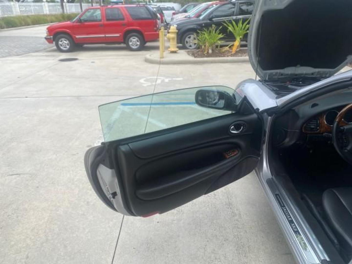 2004 Quartz /Charcoal Jaguar XK8 CONV LOW MILES 22,128 (SAJDA42CX42) with an 4.2L DOHC EFI 32-Valve Aluminum Alloy V8 Engine engine, Automatic transmission, located at 4701 North Dixie Hwy, Pompano Beach, FL, 33064, (954) 422-2889, 26.240938, -80.123474 - OUR WEBPAGE FLORIDACARS1.COM HAS OVER 100 PHOTOS AND FREE CARFAX LINK 2004 JAGUAR XK-SERIES XK8 $ 75,530 NEW VIN: SAJDA42CX42A37634 S A J D A 4 2 C X 4 2 A 3 7 6 3 4 CONVERTIBLE 4.2L V8 F DOHC GASOLINE REAR WHEEL DRIVE TOP WORKS GREAT! TIRES ARE LIKE NEW! Top Features Alloy Wheels Leather Seats Alpi - Photo#9