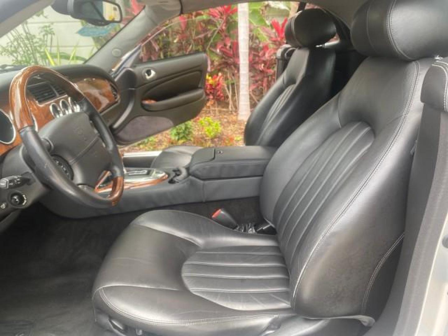 2004 Quartz /Charcoal Jaguar XK8 CONV LOW MILES 22,128 (SAJDA42CX42) with an 4.2L DOHC EFI 32-Valve Aluminum Alloy V8 Engine engine, Automatic transmission, located at 4701 North Dixie Hwy, Pompano Beach, FL, 33064, (954) 422-2889, 26.240938, -80.123474 - OUR WEBPAGE FLORIDACARS1.COM HAS OVER 100 PHOTOS AND FREE CARFAX LINK 2004 JAGUAR XK-SERIES XK8 $ 75,530 NEW VIN: SAJDA42CX42A37634 S A J D A 4 2 C X 4 2 A 3 7 6 3 4 CONVERTIBLE 4.2L V8 F DOHC GASOLINE REAR WHEEL DRIVE TOP WORKS GREAT! TIRES ARE LIKE NEW! Top Features Alloy Wheels Leather Seats Alpi - Photo#10