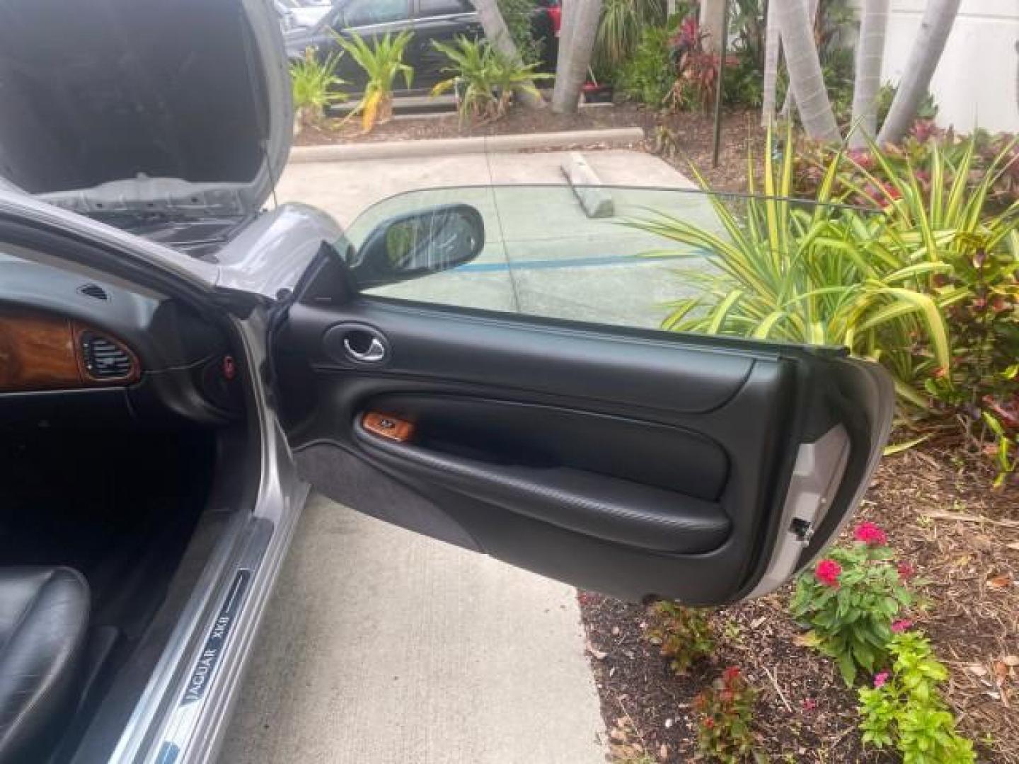 2004 Quartz /Charcoal Jaguar XK8 CONV LOW MILES 22,128 (SAJDA42CX42) with an 4.2L DOHC EFI 32-Valve Aluminum Alloy V8 Engine engine, Automatic transmission, located at 4701 North Dixie Hwy, Pompano Beach, FL, 33064, (954) 422-2889, 26.240938, -80.123474 - OUR WEBPAGE FLORIDACARS1.COM HAS OVER 100 PHOTOS AND FREE CARFAX LINK 2004 JAGUAR XK-SERIES XK8 $ 75,530 NEW VIN: SAJDA42CX42A37634 S A J D A 4 2 C X 4 2 A 3 7 6 3 4 CONVERTIBLE 4.2L V8 F DOHC GASOLINE REAR WHEEL DRIVE TOP WORKS GREAT! TIRES ARE LIKE NEW! Top Features Alloy Wheels Leather Seats Alpi - Photo#11