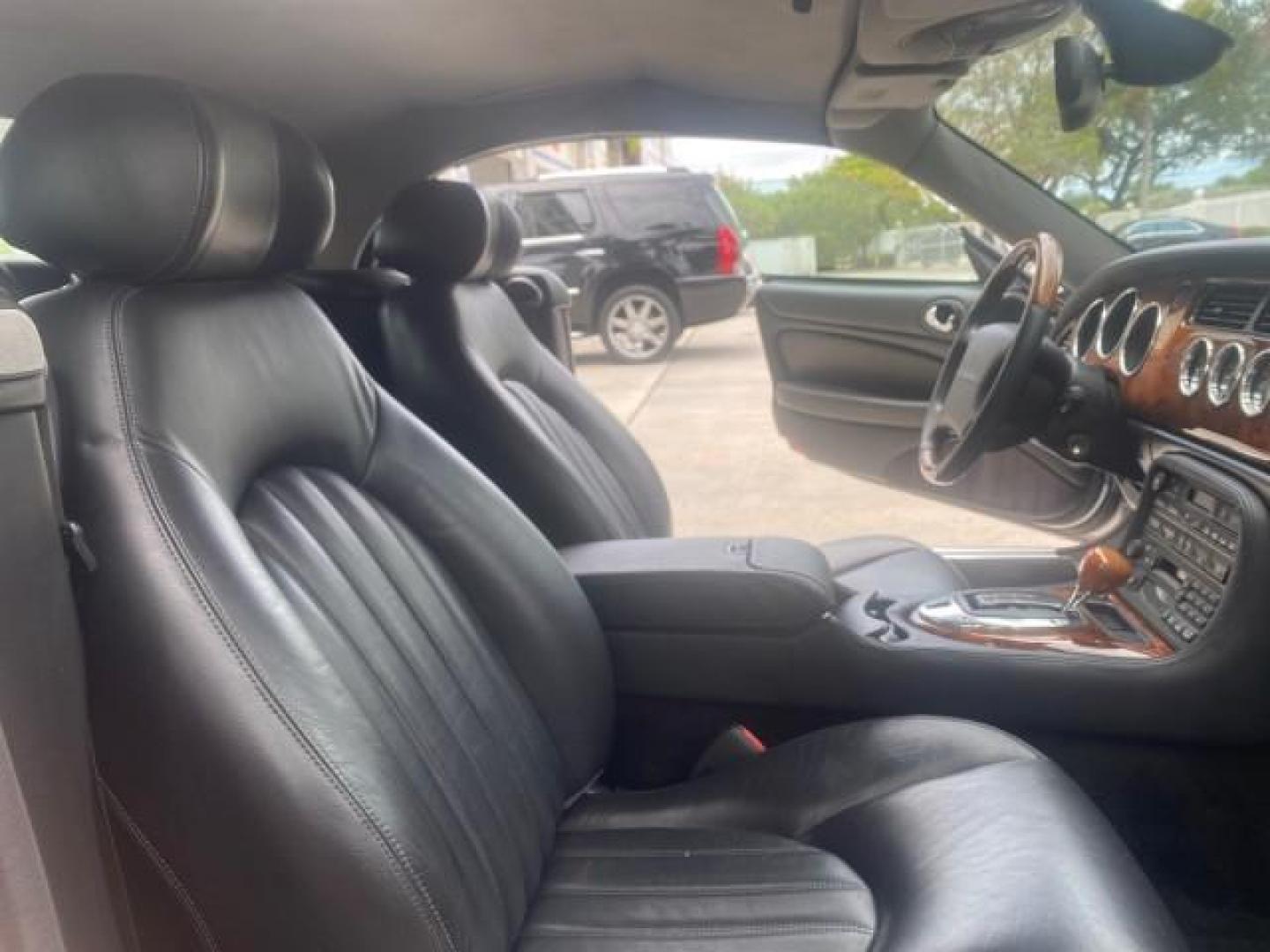 2004 Quartz /Charcoal Jaguar XK8 CONV LOW MILES 22,128 (SAJDA42CX42) with an 4.2L DOHC EFI 32-Valve Aluminum Alloy V8 Engine engine, Automatic transmission, located at 4701 North Dixie Hwy, Pompano Beach, FL, 33064, (954) 422-2889, 26.240938, -80.123474 - OUR WEBPAGE FLORIDACARS1.COM HAS OVER 100 PHOTOS AND FREE CARFAX LINK 2004 JAGUAR XK-SERIES XK8 $ 75,530 NEW VIN: SAJDA42CX42A37634 S A J D A 4 2 C X 4 2 A 3 7 6 3 4 CONVERTIBLE 4.2L V8 F DOHC GASOLINE REAR WHEEL DRIVE TOP WORKS GREAT! TIRES ARE LIKE NEW! Top Features Alloy Wheels Leather Seats Alpi - Photo#12