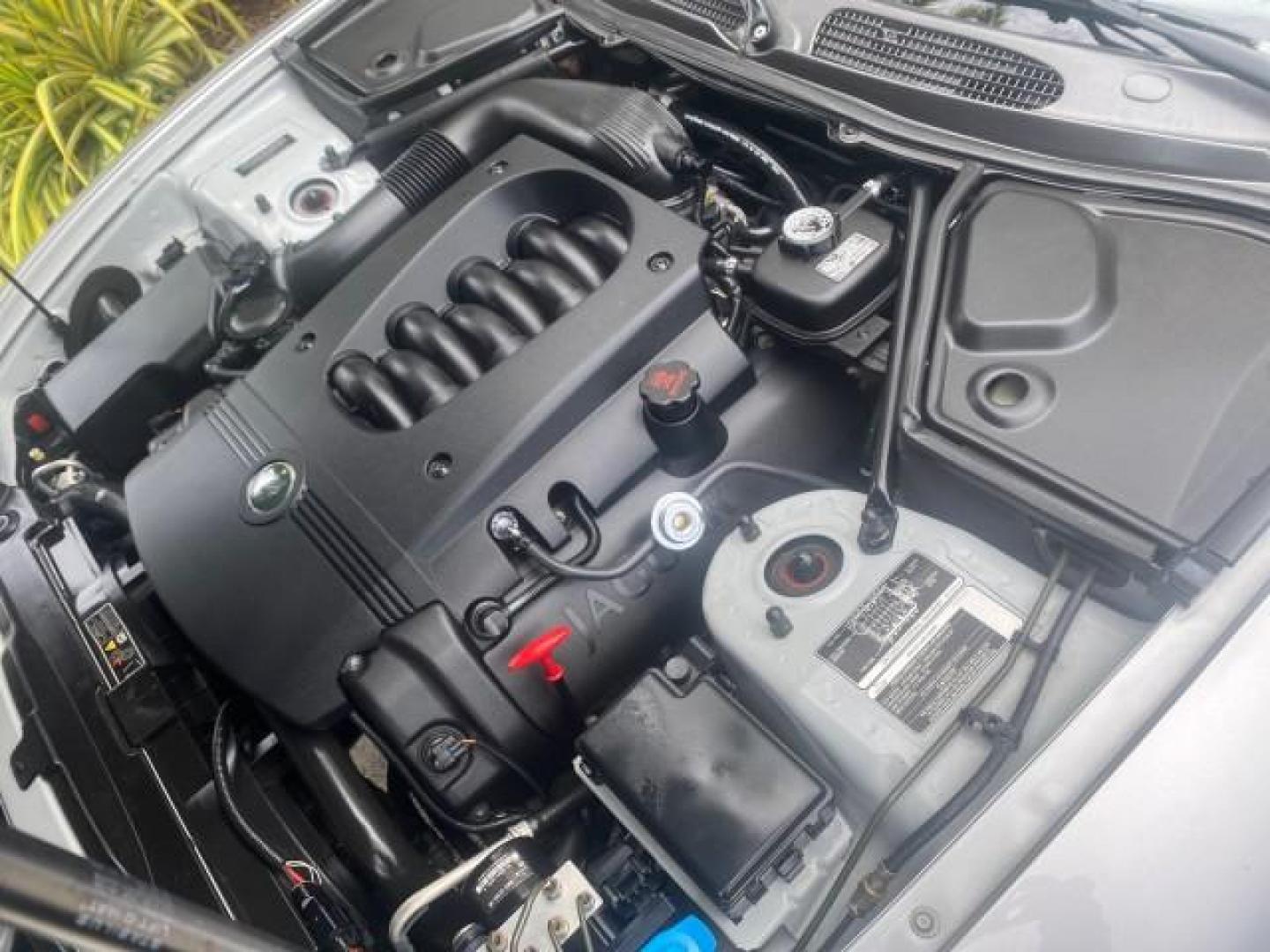 2004 Quartz /Charcoal Jaguar XK8 CONV LOW MILES 22,128 (SAJDA42CX42) with an 4.2L DOHC EFI 32-Valve Aluminum Alloy V8 Engine engine, Automatic transmission, located at 4701 North Dixie Hwy, Pompano Beach, FL, 33064, (954) 422-2889, 26.240938, -80.123474 - OUR WEBPAGE FLORIDACARS1.COM HAS OVER 100 PHOTOS AND FREE CARFAX LINK 2004 JAGUAR XK-SERIES XK8 $ 75,530 NEW VIN: SAJDA42CX42A37634 S A J D A 4 2 C X 4 2 A 3 7 6 3 4 CONVERTIBLE 4.2L V8 F DOHC GASOLINE REAR WHEEL DRIVE TOP WORKS GREAT! TIRES ARE LIKE NEW! Top Features Alloy Wheels Leather Seats Alpi - Photo#26