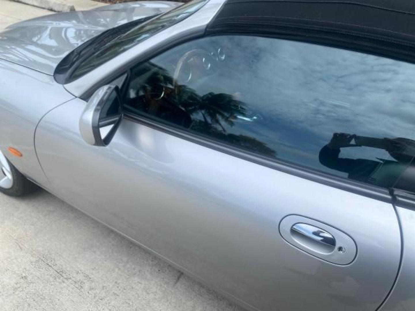 2004 Quartz /Charcoal Jaguar XK8 CONV LOW MILES 22,128 (SAJDA42CX42) with an 4.2L DOHC EFI 32-Valve Aluminum Alloy V8 Engine engine, Automatic transmission, located at 4701 North Dixie Hwy, Pompano Beach, FL, 33064, (954) 422-2889, 26.240938, -80.123474 - OUR WEBPAGE FLORIDACARS1.COM HAS OVER 100 PHOTOS AND FREE CARFAX LINK 2004 JAGUAR XK-SERIES XK8 $ 75,530 NEW VIN: SAJDA42CX42A37634 S A J D A 4 2 C X 4 2 A 3 7 6 3 4 CONVERTIBLE 4.2L V8 F DOHC GASOLINE REAR WHEEL DRIVE TOP WORKS GREAT! TIRES ARE LIKE NEW! Top Features Alloy Wheels Leather Seats Alpi - Photo#31