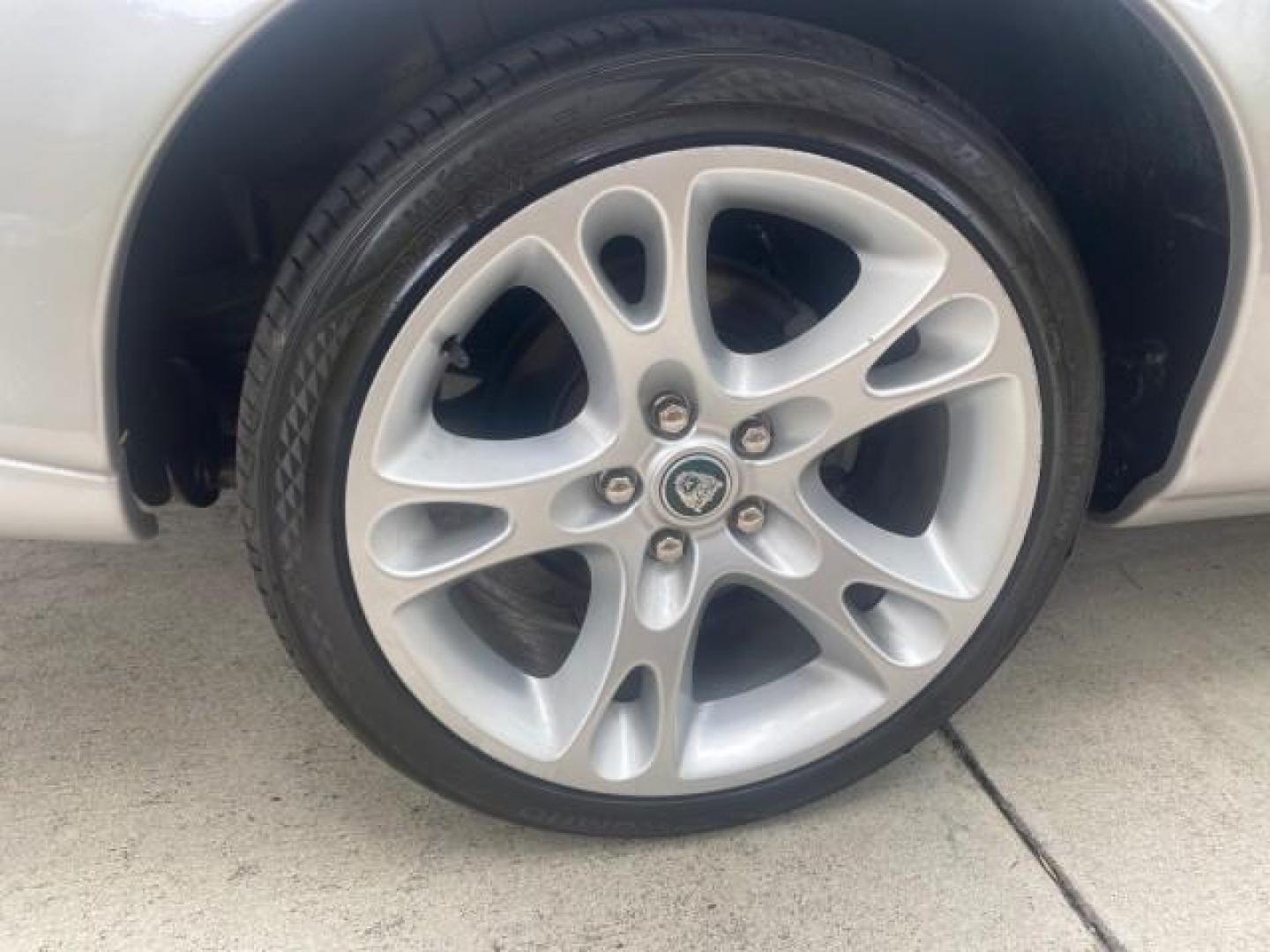 2004 Quartz /Charcoal Jaguar XK8 CONV LOW MILES 22,128 (SAJDA42CX42) with an 4.2L DOHC EFI 32-Valve Aluminum Alloy V8 Engine engine, Automatic transmission, located at 4701 North Dixie Hwy, Pompano Beach, FL, 33064, (954) 422-2889, 26.240938, -80.123474 - OUR WEBPAGE FLORIDACARS1.COM HAS OVER 100 PHOTOS AND FREE CARFAX LINK 2004 JAGUAR XK-SERIES XK8 $ 75,530 NEW VIN: SAJDA42CX42A37634 S A J D A 4 2 C X 4 2 A 3 7 6 3 4 CONVERTIBLE 4.2L V8 F DOHC GASOLINE REAR WHEEL DRIVE TOP WORKS GREAT! TIRES ARE LIKE NEW! Top Features Alloy Wheels Leather Seats Alpi - Photo#85