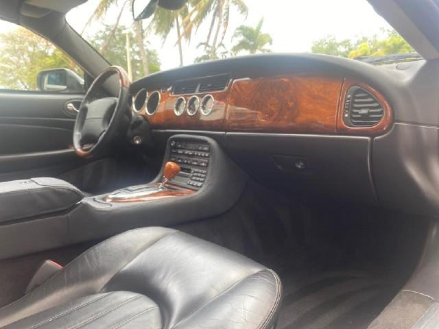2004 Quartz /Charcoal Jaguar XK8 CONV LOW MILES 22,128 (SAJDA42CX42) with an 4.2L DOHC EFI 32-Valve Aluminum Alloy V8 Engine engine, Automatic transmission, located at 4701 North Dixie Hwy, Pompano Beach, FL, 33064, (954) 422-2889, 26.240938, -80.123474 - OUR WEBPAGE FLORIDACARS1.COM HAS OVER 100 PHOTOS AND FREE CARFAX LINK 2004 JAGUAR XK-SERIES XK8 $ 75,530 NEW VIN: SAJDA42CX42A37634 S A J D A 4 2 C X 4 2 A 3 7 6 3 4 CONVERTIBLE 4.2L V8 F DOHC GASOLINE REAR WHEEL DRIVE TOP WORKS GREAT! TIRES ARE LIKE NEW! Top Features Alloy Wheels Leather Seats Alpi - Photo#93
