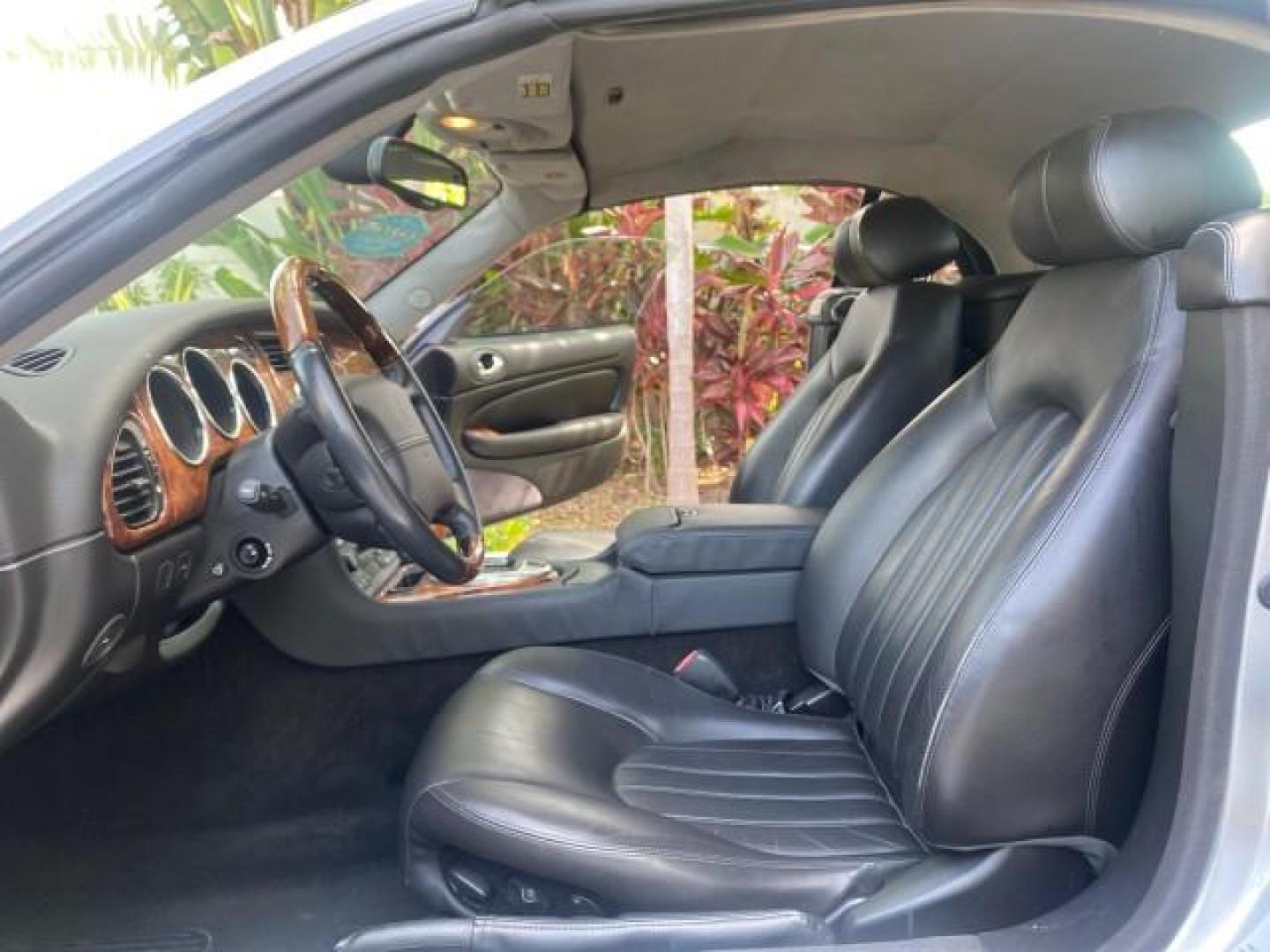 2004 Quartz /Charcoal Jaguar XK8 XK8 CONV LOW MILES 22,152 (SAJDA42CX42) with an 4.2L DOHC EFI 32-Valve Aluminum Alloy V8 Engine engine, Automatic transmission, located at 4701 North Dixie Hwy, Pompano Beach, FL, 33064, (954) 422-2889, 26.240938, -80.123474 - OUR WEBPAGE FLORIDACARS1.COM HAS OVER 100 PHOTOS AND FREE CARFAX LINK 2004 JAGUAR XK-SERIES XK8 $ 75,530 NEW VIN: SAJDA42CX42A37634 S A J D A 4 2 C X 4 2 A 3 7 6 3 4 CONVERTIBLE 4.2L V8 F DOHC GASOLINE REAR WHEEL DRIVE TOP WORKS GREAT! TIRES ARE LIKE NEW! Top Features Alloy Wheels Leather Seats Alpi - Photo#10