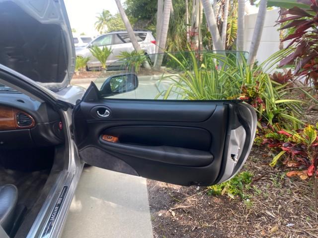 2004 Quartz /Charcoal Jaguar XK8 CONV LOW MILES 22,152 (SAJDA42CX42) with an 4.2L DOHC EFI 32-Valve Aluminum Alloy V8 Engine engine, Automatic transmission, located at 4701 North Dixie Hwy, Pompano Beach, FL, 33064, (954) 422-2889, 26.240938, -80.123474 - OUR WEBPAGE FLORIDACARS1.COM HAS OVER 100 PHOTOS AND FREE CARFAX LINK 2004 JAGUAR XK-SERIES XK8 $ 75,530 NEW VIN: SAJDA42CX42A37634 S A J D A 4 2 C X 4 2 A 3 7 6 3 4 CONVERTIBLE 4.2L V8 F DOHC GASOLINE REAR WHEEL DRIVE TOP WORKS GREAT! TIRES ARE LIKE NEW! Top Features Alloy Wheels Leather Seats Alpi - Photo#11