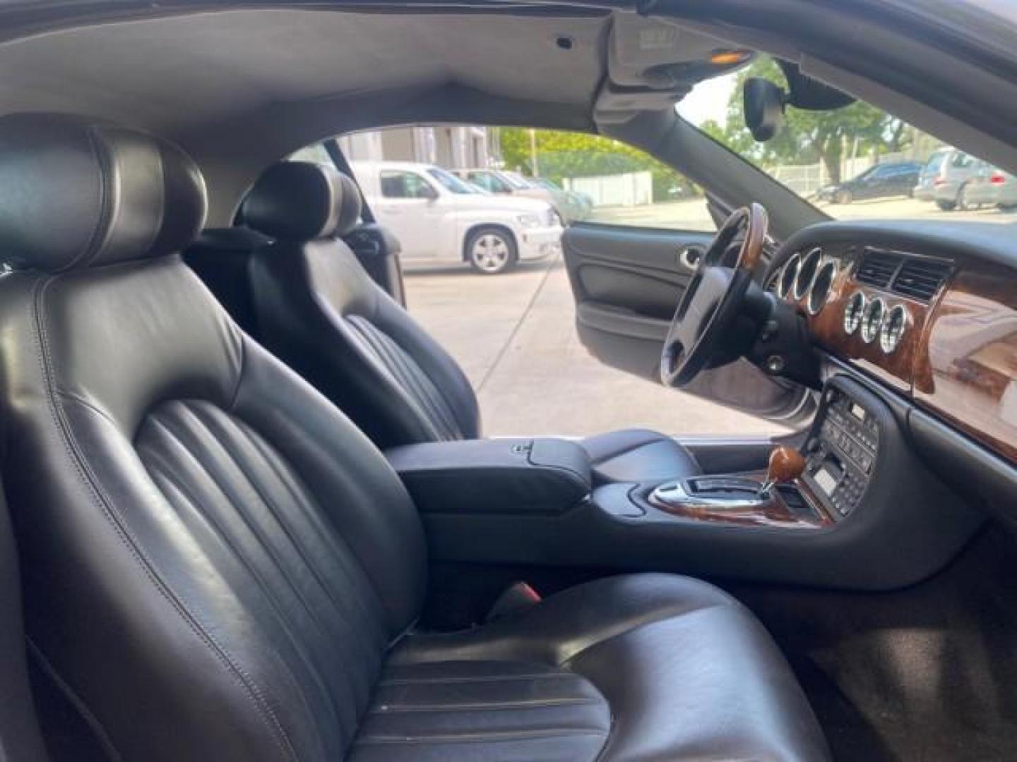 2004 Quartz /Charcoal Jaguar XK8 XK8 CONV LOW MILES 22,152 (SAJDA42CX42) with an 4.2L DOHC EFI 32-Valve Aluminum Alloy V8 Engine engine, Automatic transmission, located at 4701 North Dixie Hwy, Pompano Beach, FL, 33064, (954) 422-2889, 26.240938, -80.123474 - OUR WEBPAGE FLORIDACARS1.COM HAS OVER 100 PHOTOS AND FREE CARFAX LINK 2004 JAGUAR XK-SERIES XK8 $ 75,530 NEW VIN: SAJDA42CX42A37634 S A J D A 4 2 C X 4 2 A 3 7 6 3 4 CONVERTIBLE 4.2L V8 F DOHC GASOLINE REAR WHEEL DRIVE TOP WORKS GREAT! TIRES ARE LIKE NEW! Top Features Alloy Wheels Leather Seats Alpi - Photo#12